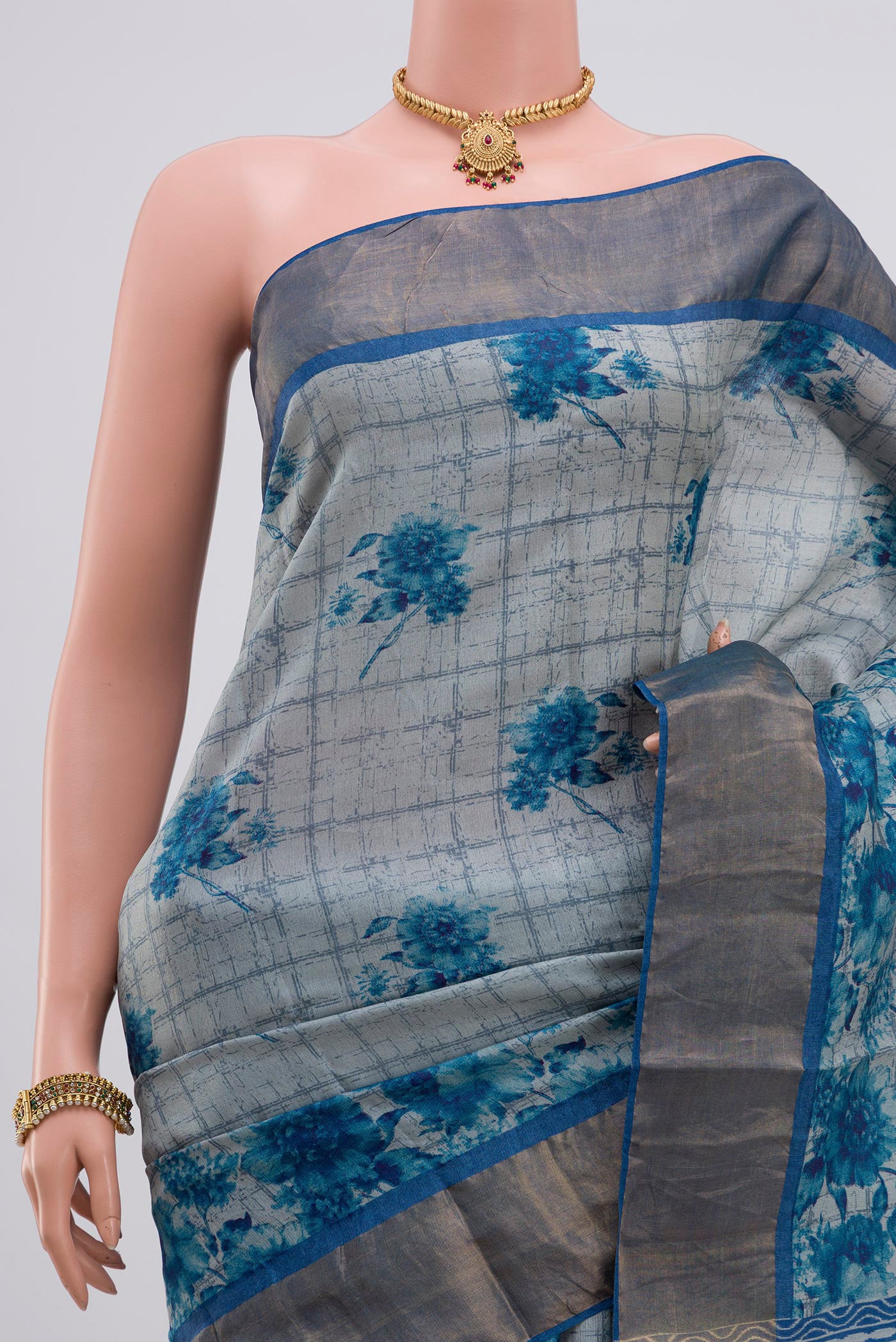 Border image of Blue Tussar Silk Saree with Printed design on the body and Zari Border. 