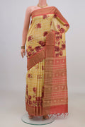 Yellow Tussar Saree with Floral Print on the body and Zari Border.  displayed on a mannequin