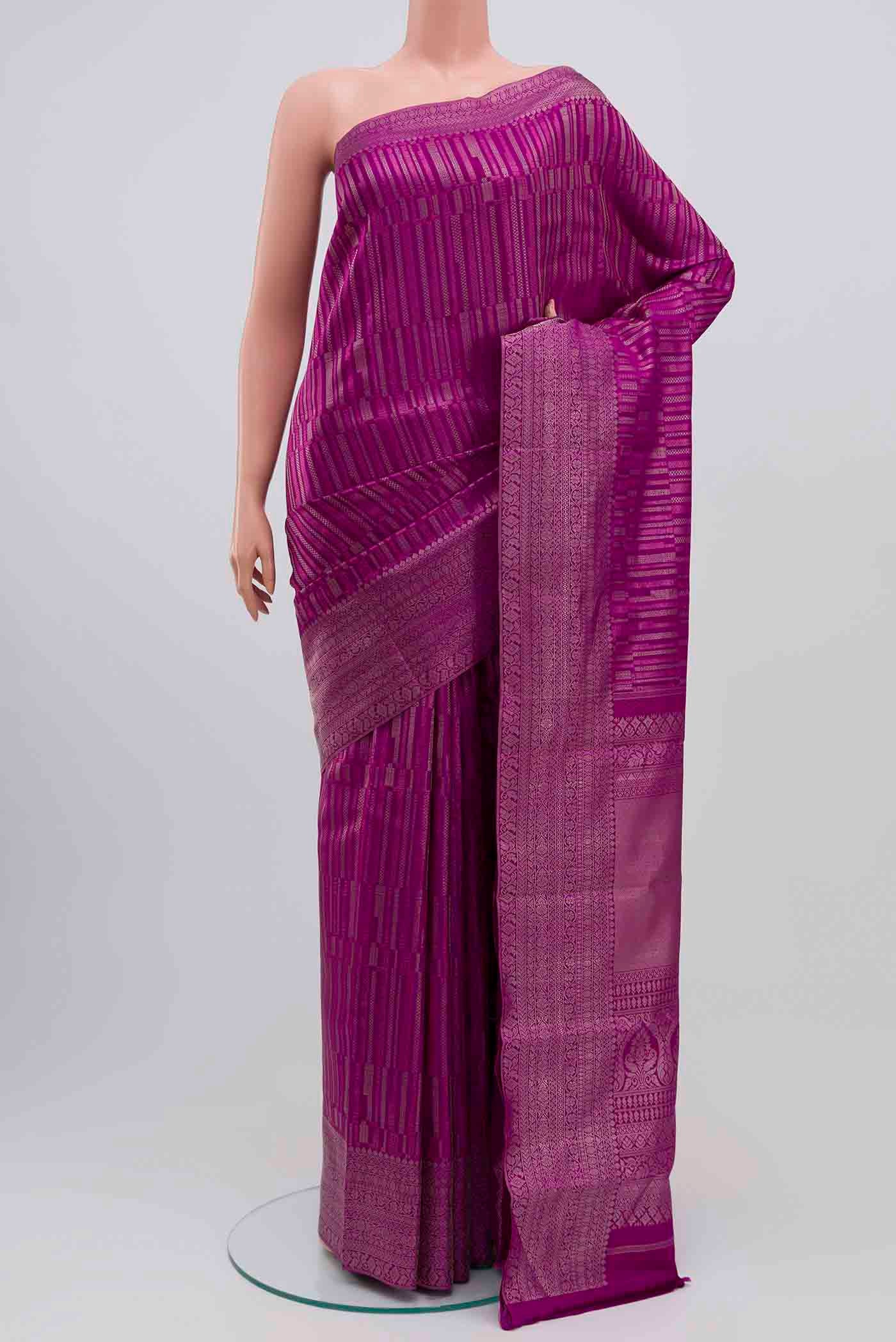 Purple Kanchipuram Silk Saree with Zari Brocade on the body and Silk Border displayed on a mannequin