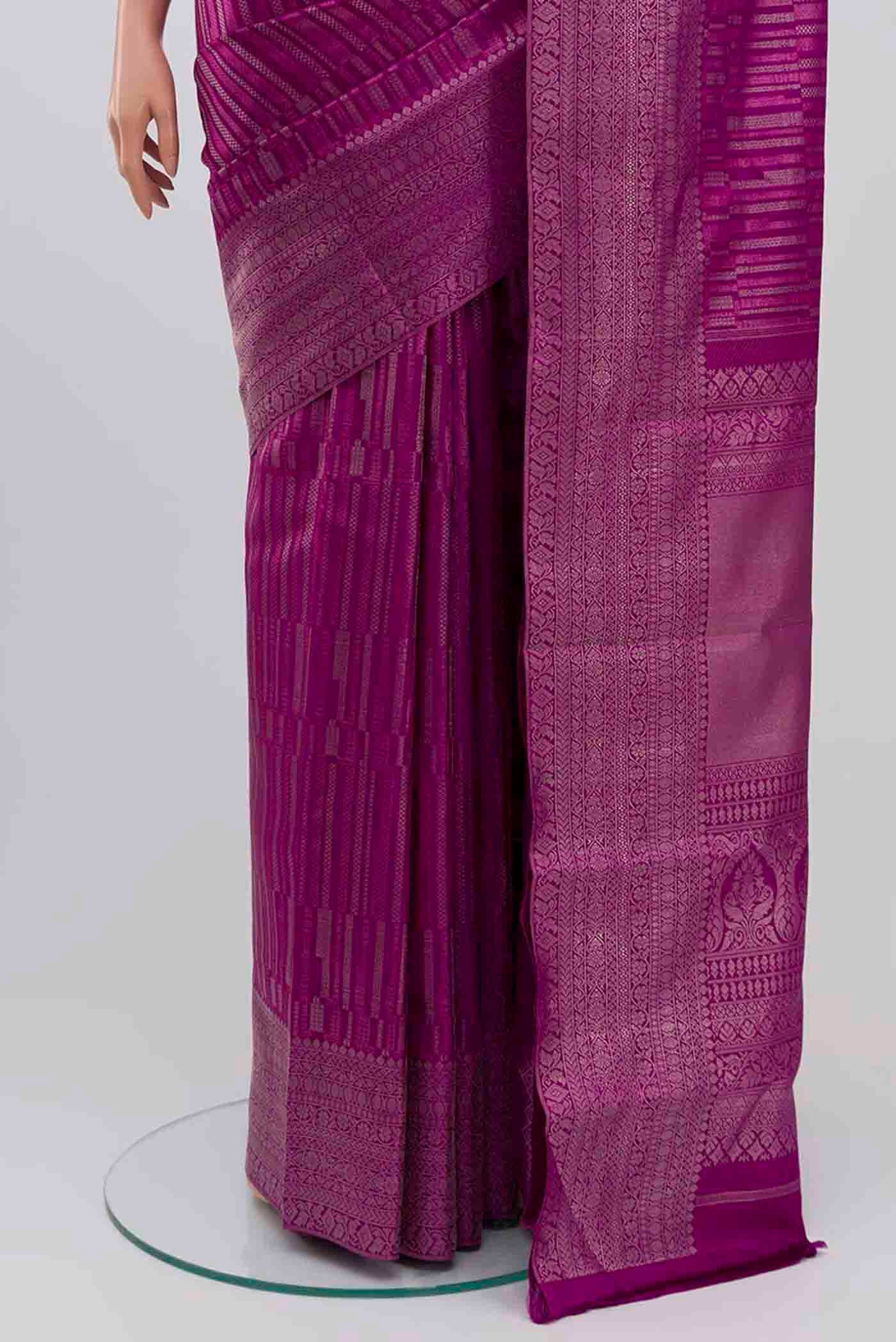 Pleats and pallu of Purple Kanchipuram Silk Saree with Zari Brocade on the body and Silk Border