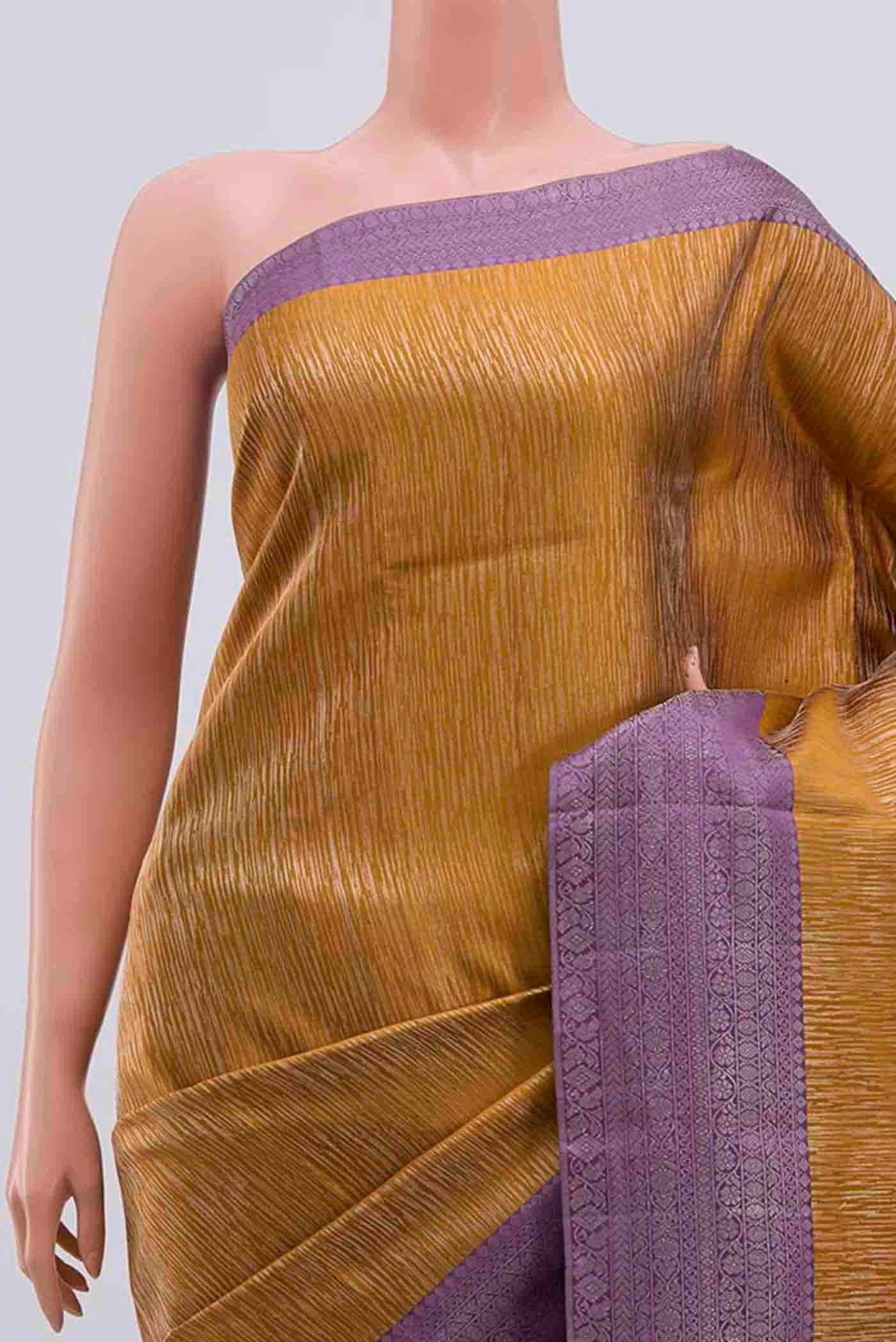 Border image of Mustard Kanchipuram Silk Saree with Zari Brocade on the body and Zari Border