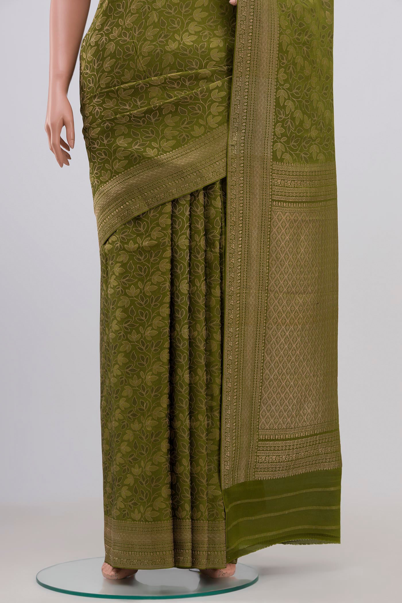 Pleats and pallu of Green Mysore Crepe Saree with Zari Brocade on the body and Fancy Border. 