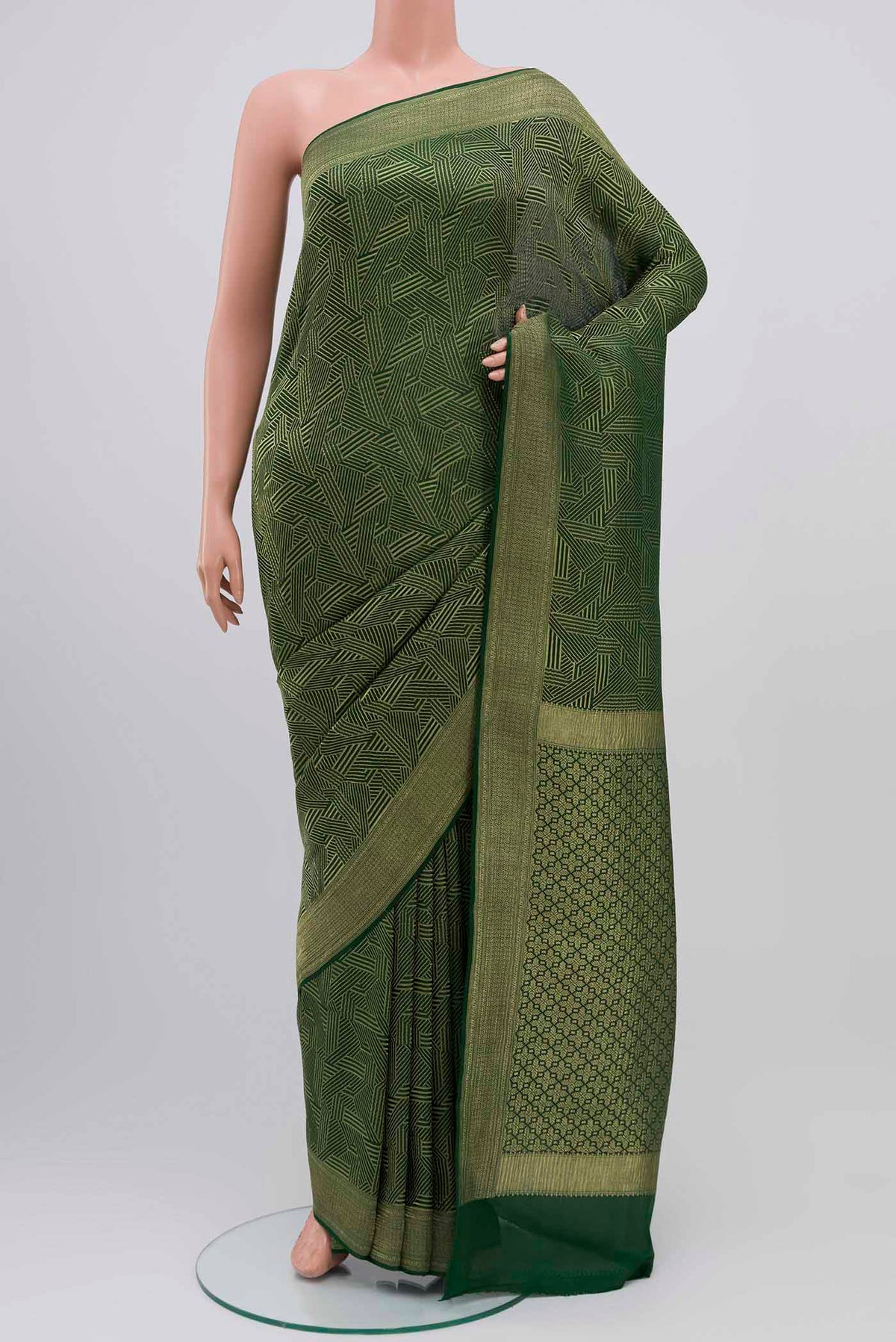 Bottle Green Mysore Crepe Saree with Zari Brocade on the body and Zari Border displayed on a mannequin