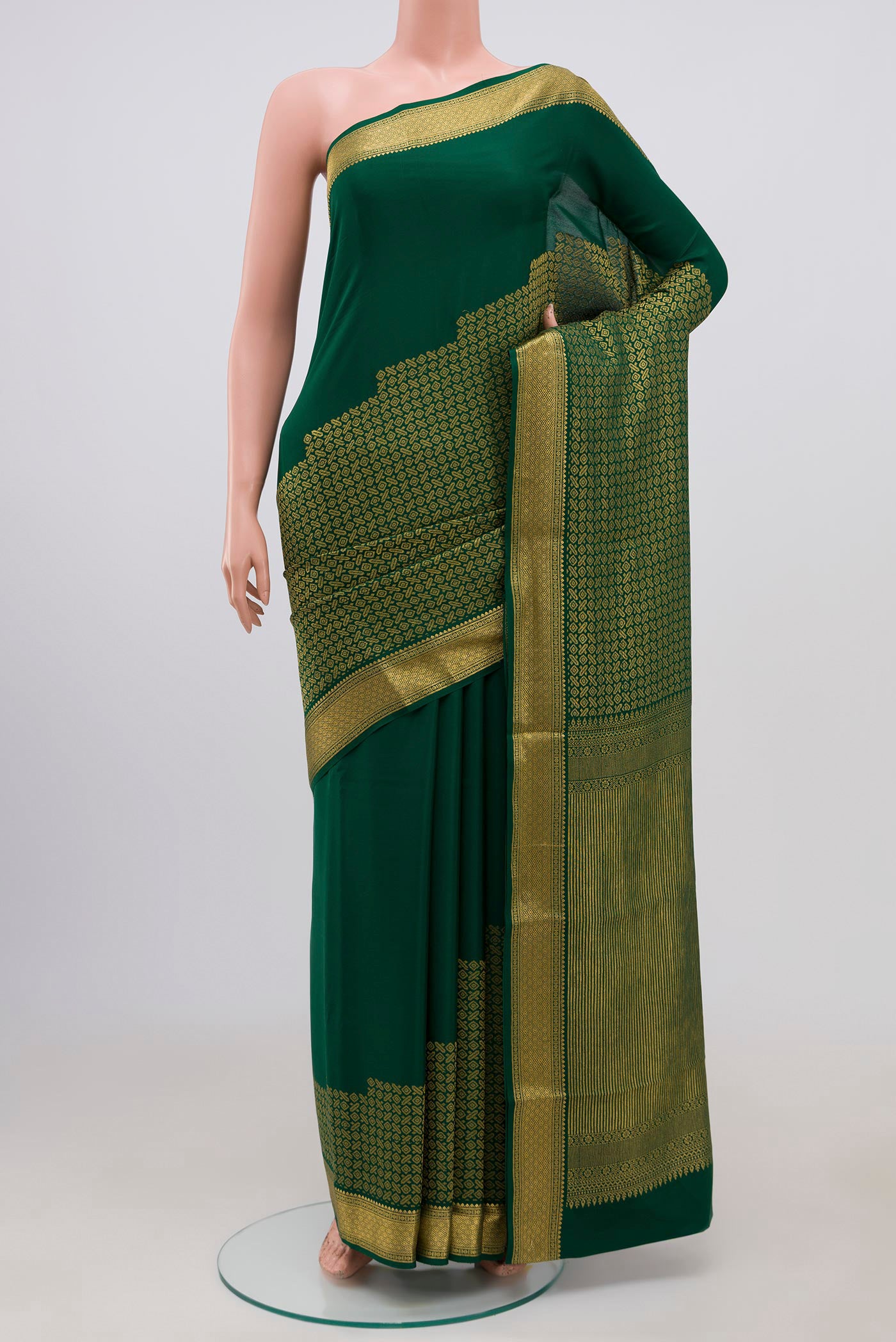 Green Mysore Crepe Saree with Zari Brocade on the body and Zari Border.  displayed on a mannequin