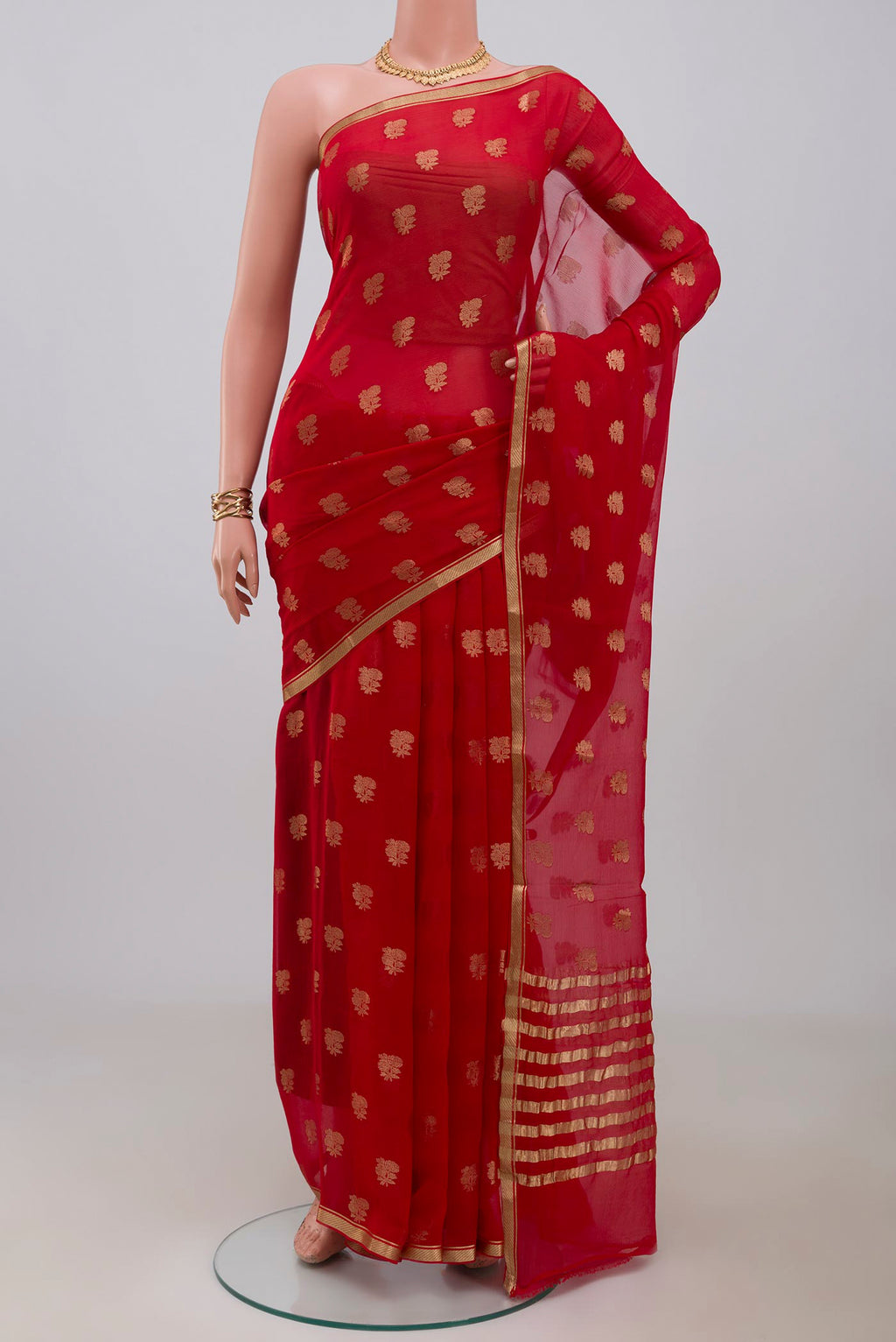 Red Mysore Chiffon Saree with Zari Butta on the body and Zari Border.  displayed on a mannequin