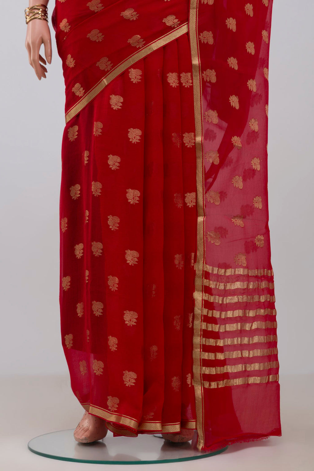 Pleats and pallu of Red Mysore Chiffon Saree with Zari Butta on the body and Zari Border. 