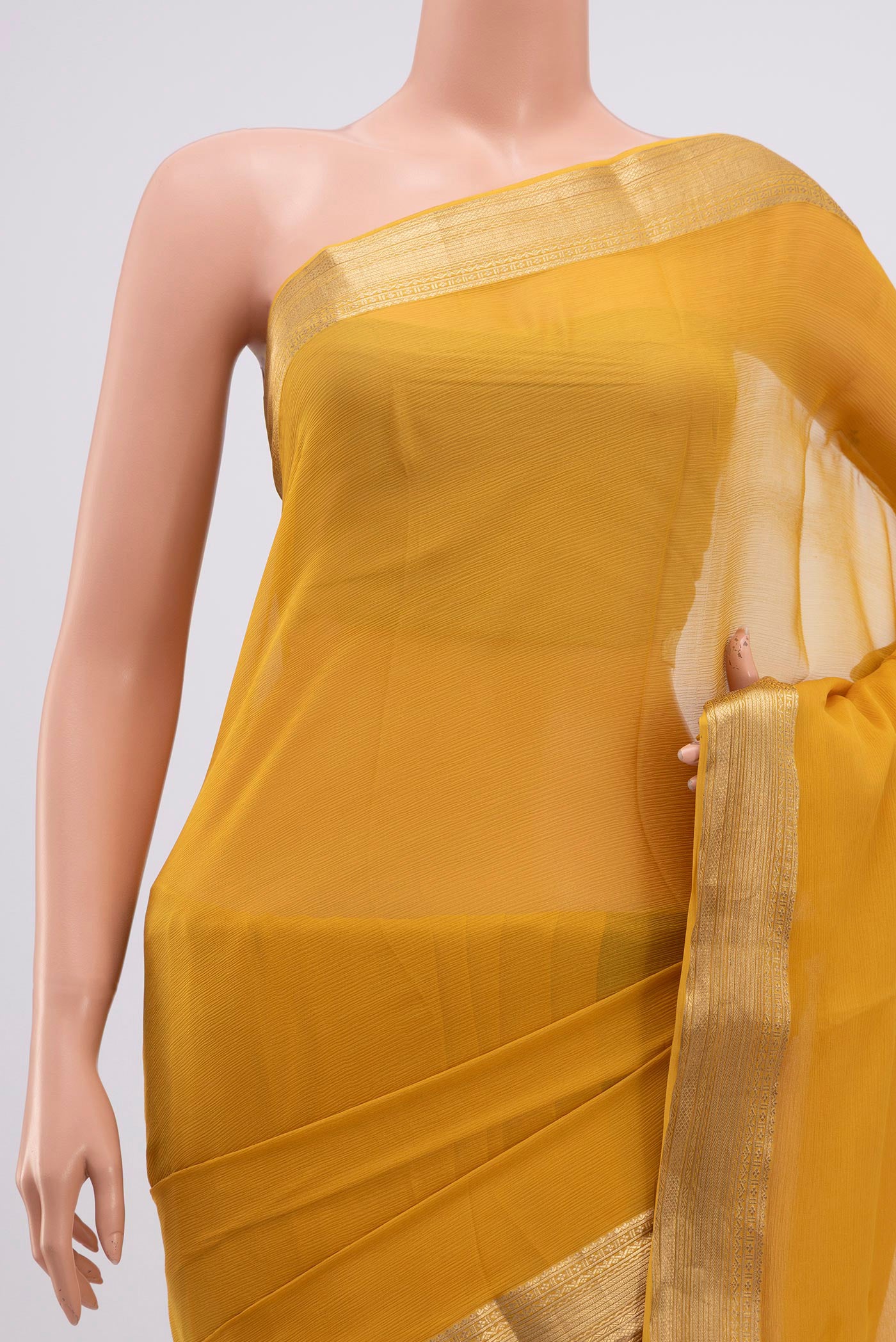 Border image of Yellow Chiffon Saree with Plain Body and Zari Border. 