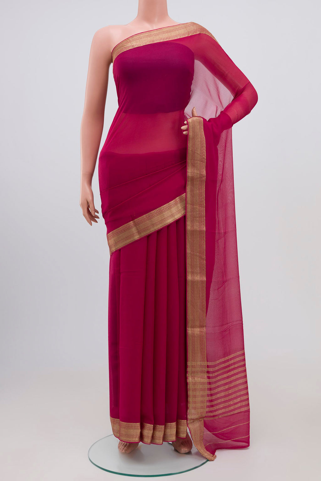 Rani Pink Chiffon Saree with Plain Body and Zari Border.  displayed on a mannequin