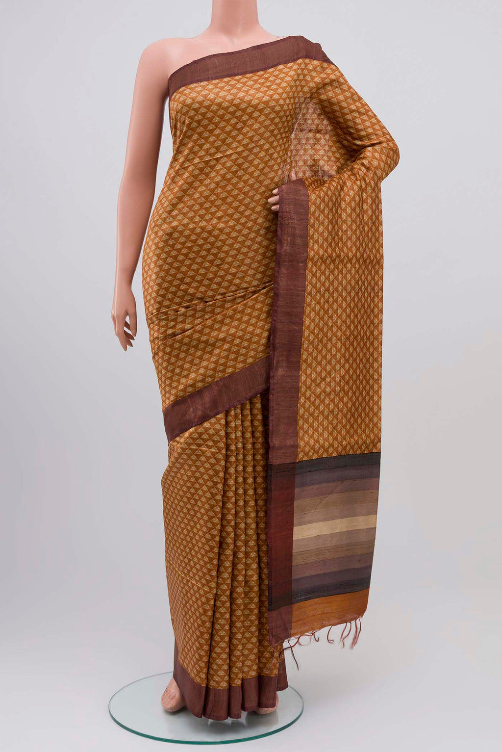 Mustard Bhagalpuri Tussar Silk Saree with Printed design on the body and Zari Border displayed on a mannequin