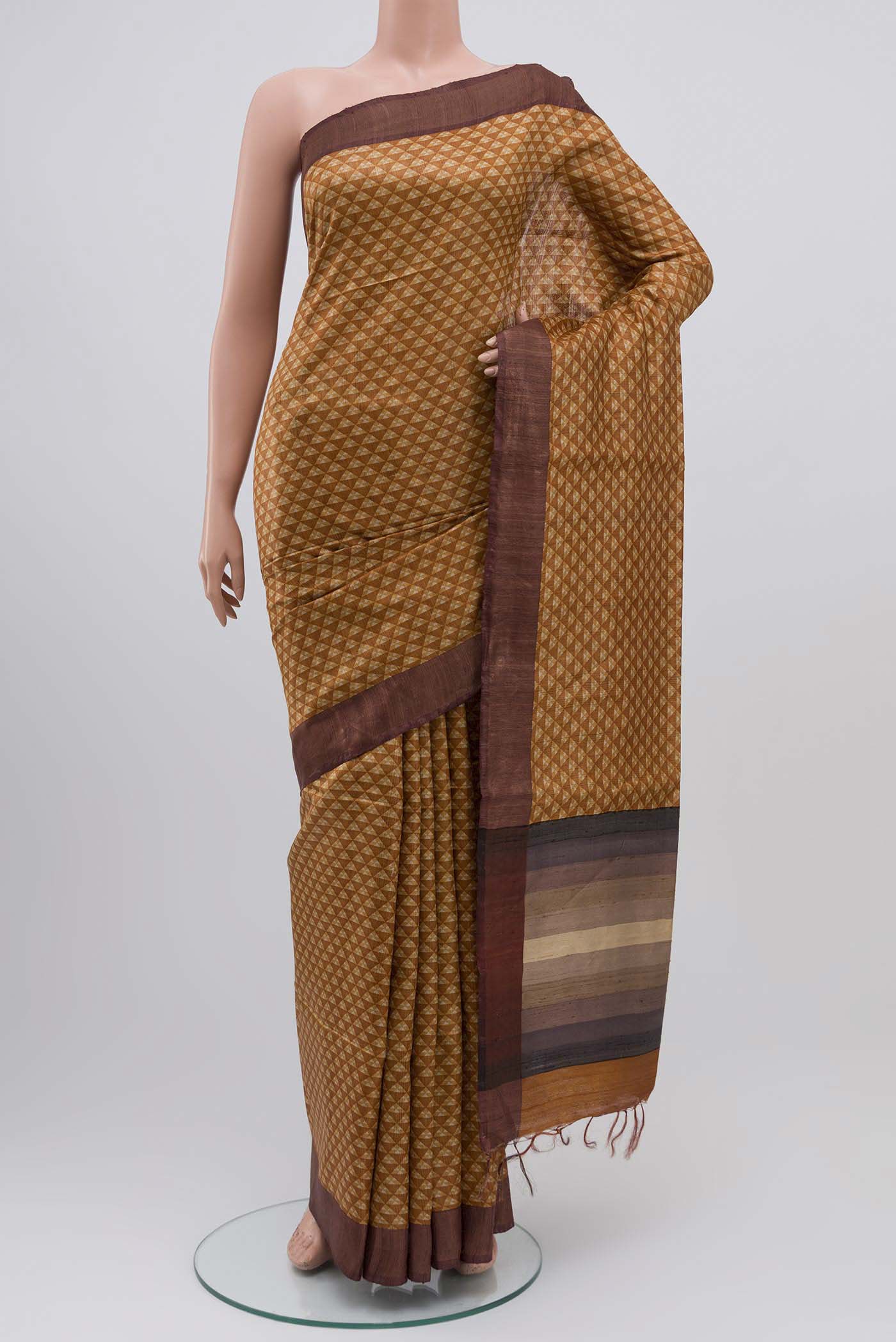 Mustard Bhagalpuri Tussar Silk Saree with Printed design on the body and Zari Border displayed on a mannequin