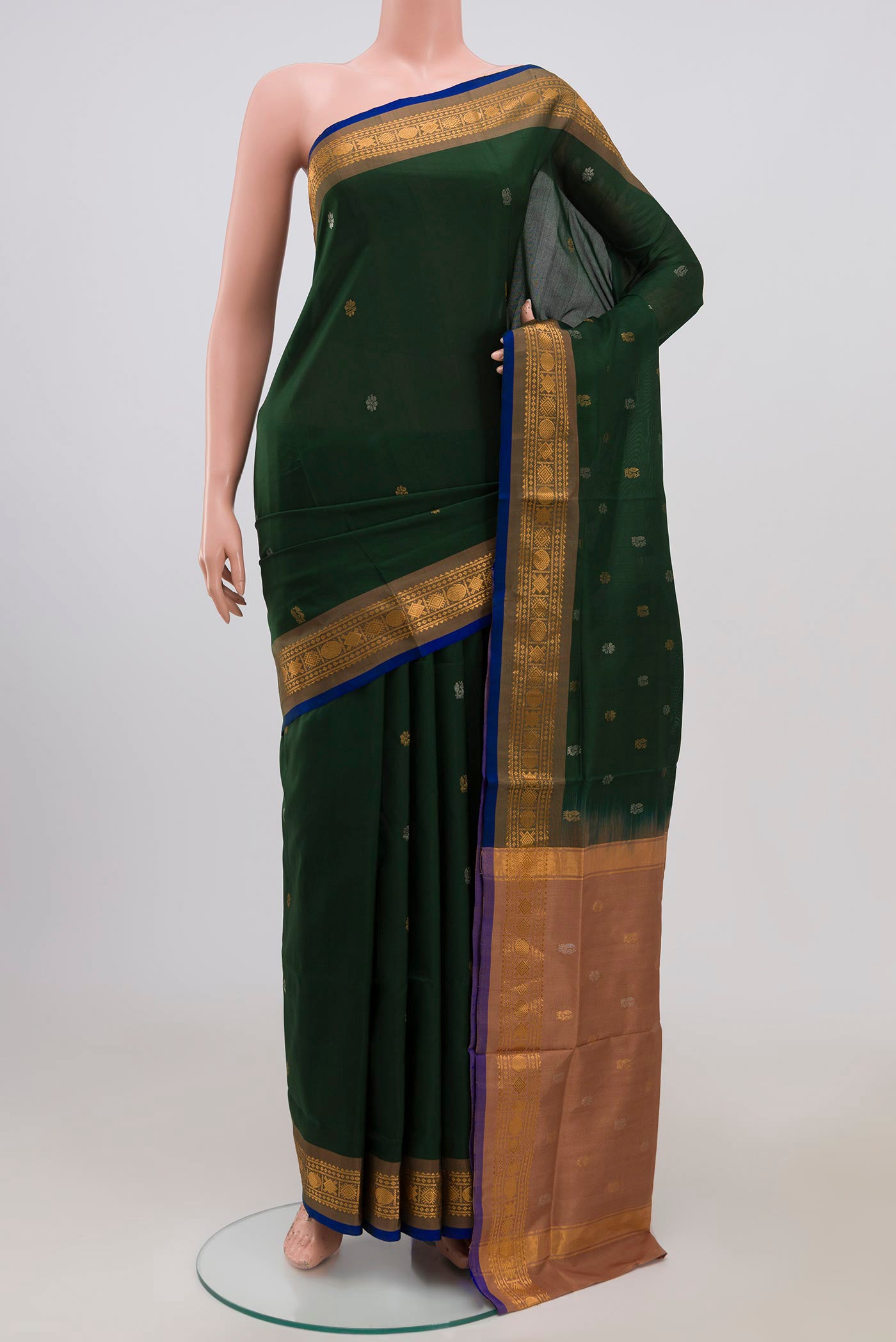Green Uppada Silk Saree with Zari Butta on the body and Zari Border.  displayed on a mannequin
