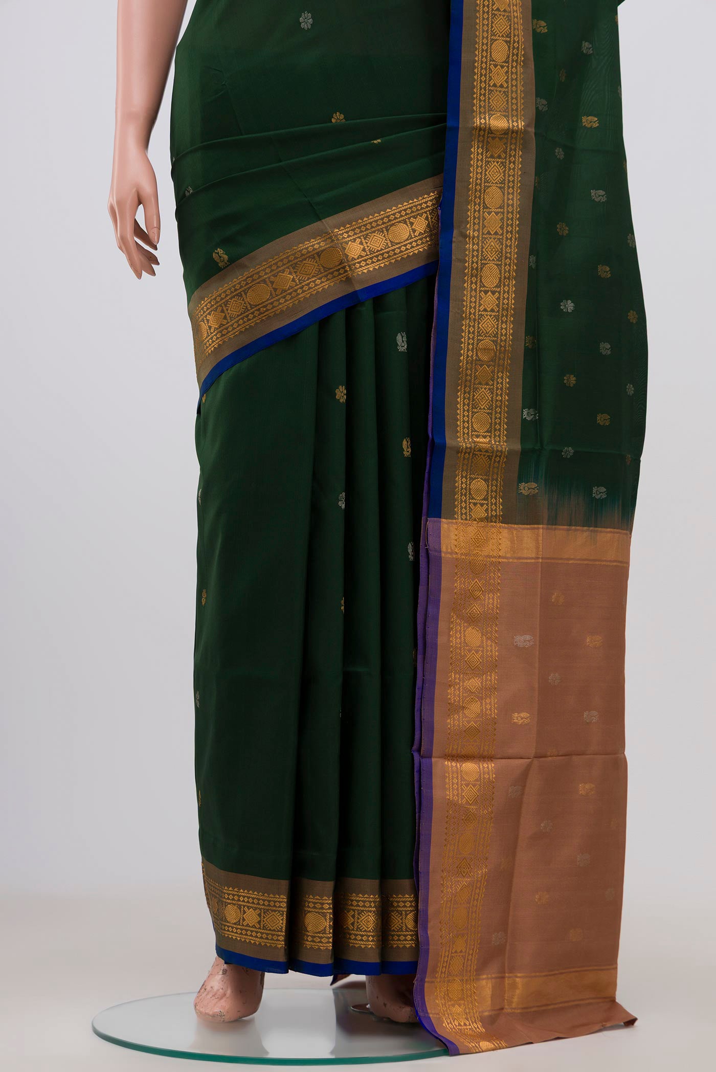 Pleats and pallu of Green Uppada Silk Saree with Zari Butta on the body and Zari Border. 