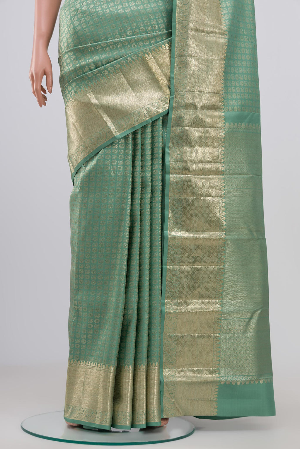 Pleats and pallu of Light Green Kanchipuram Silk Saree with Zari Brocade on the body and Zari Border. 