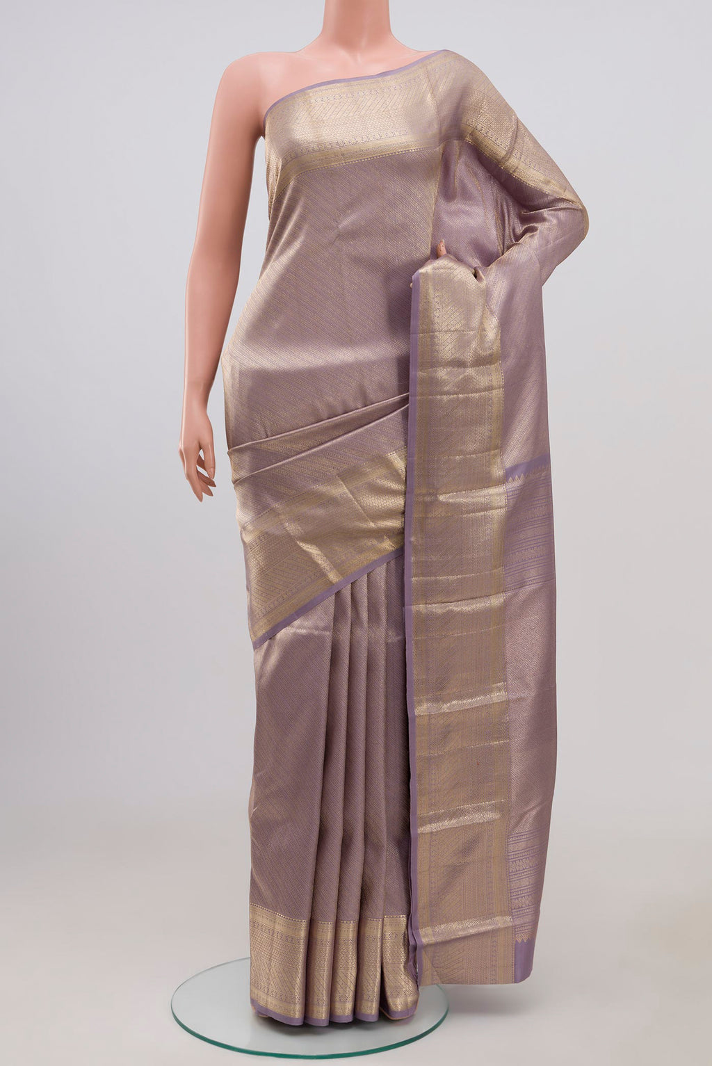 Lavender Kanchipuram Silk Saree with Zari Brocade on the body and Zari Border.  displayed on a mannequin