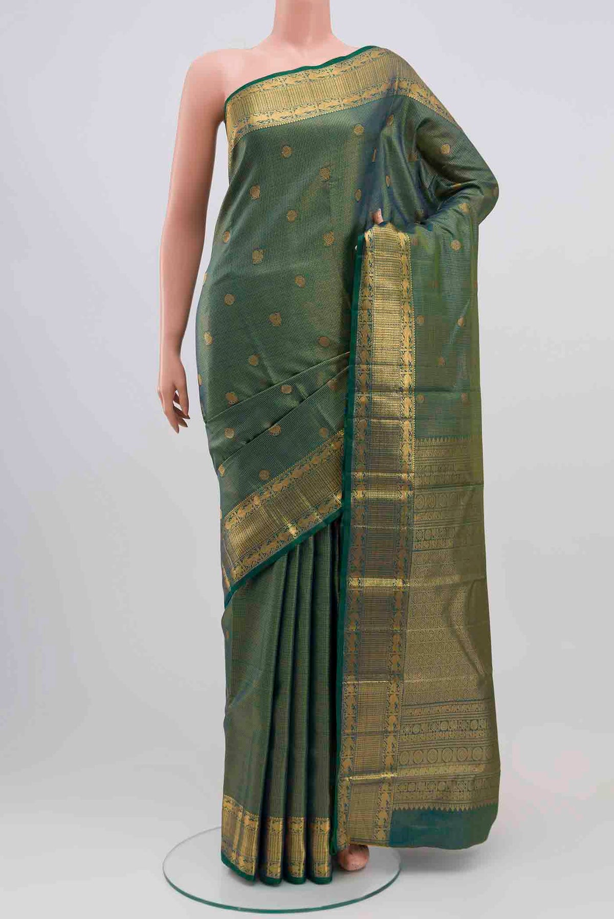 Green With Blue Color Kanchipuram Silk Saree with Checked design on the body and Zari Border displayed on a mannequin
