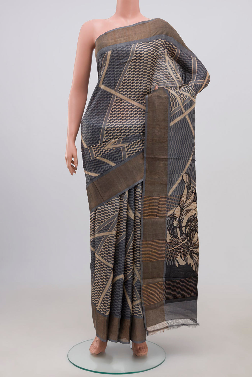 Grey Tussar Silk Saree with Printed design on the body and Zari Border.  displayed on a mannequin