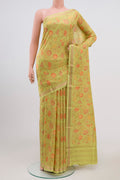 Parrot Green Printed Silk Saree with Printed design on the body and Zari Border.  displayed on a mannequin