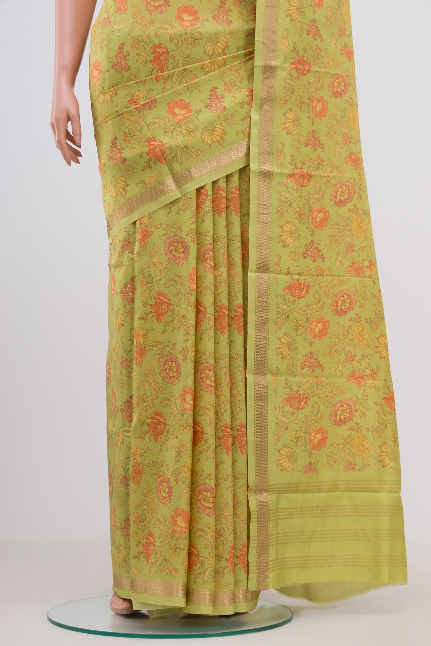 Pleats and pallu of Parrot Green Printed Silk Saree with Printed design on the body and Zari Border. 