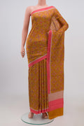 Yellow Printed Silk Saree with Printed design on the body and Plain Border.  displayed on a mannequin