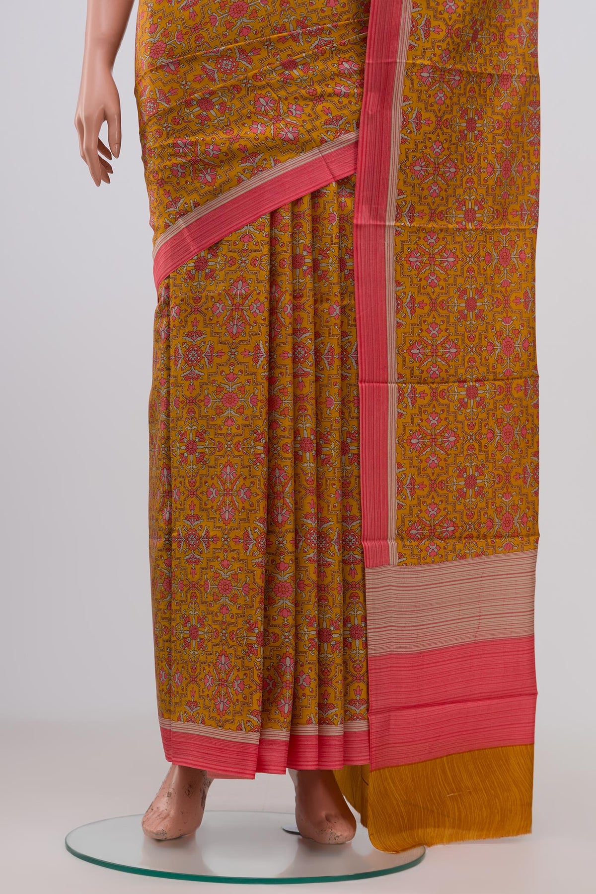 Pleats and pallu of Yellow Printed Silk Saree with Printed design on the body and Plain Border. 