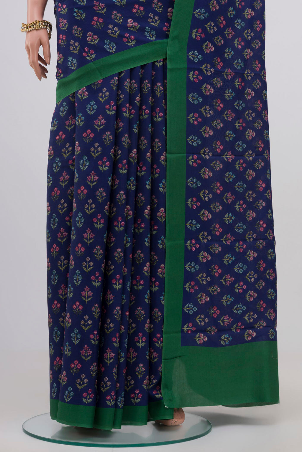Pleats and pallu of Blue Printed Silk Saree with Printed design on the body and Plain Border. 