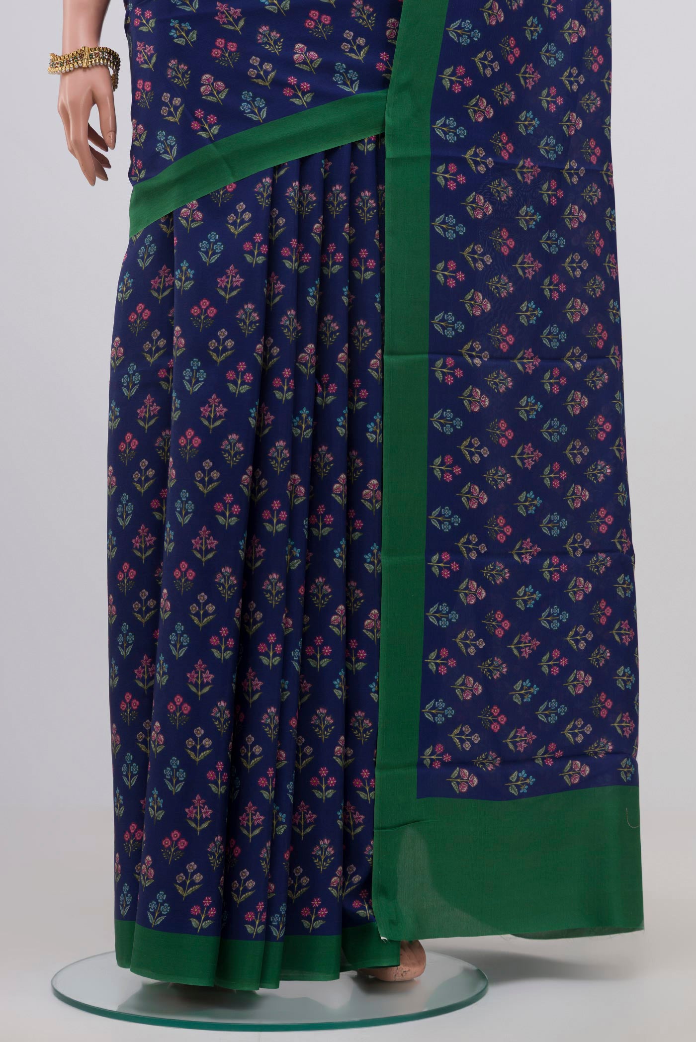 Pleats and pallu of Blue Printed Silk Saree with Printed design on the body and Plain Border. 