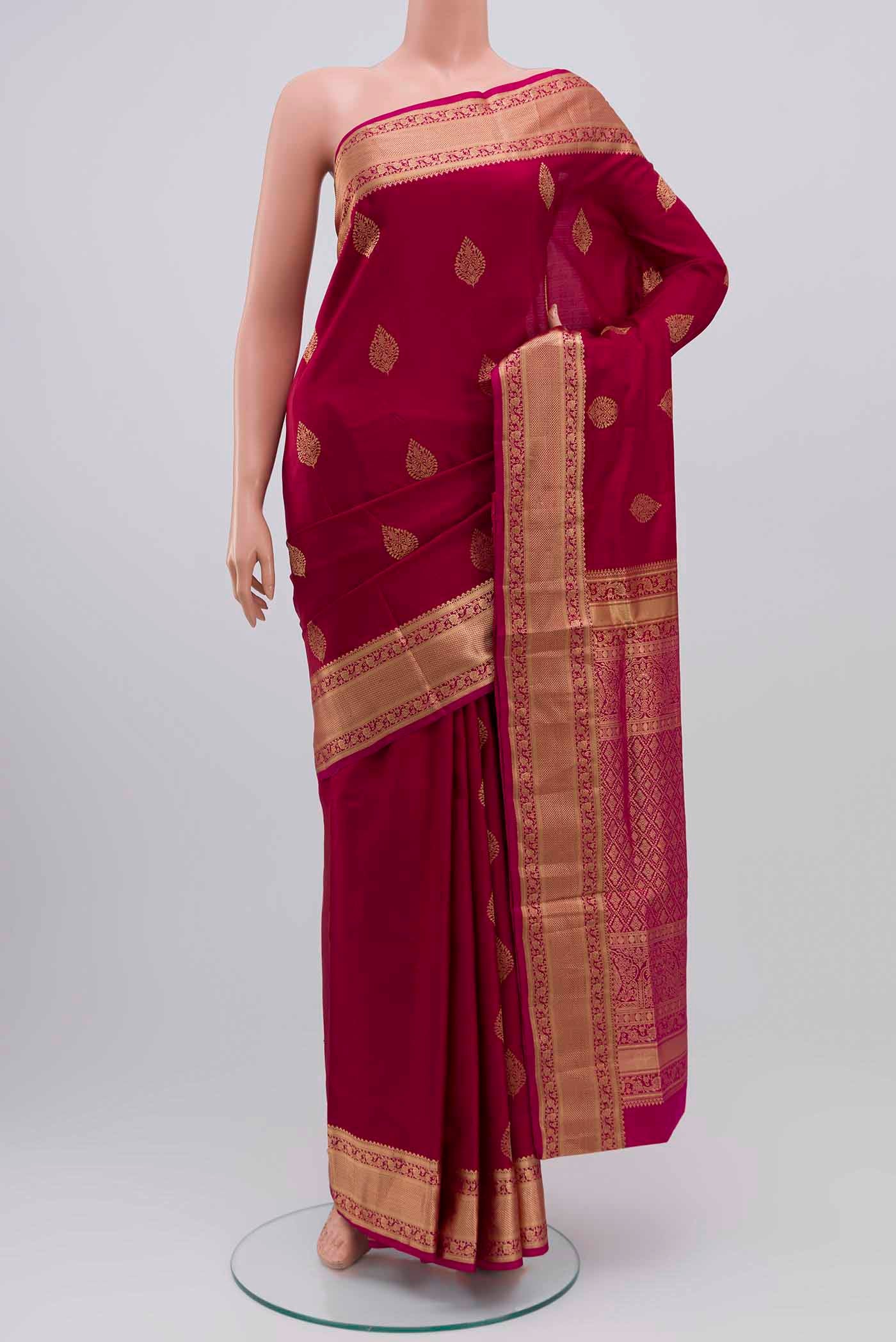 Magenta Soft Silk Saree with Zari Butta on the body and Zari Border displayed on a mannequin