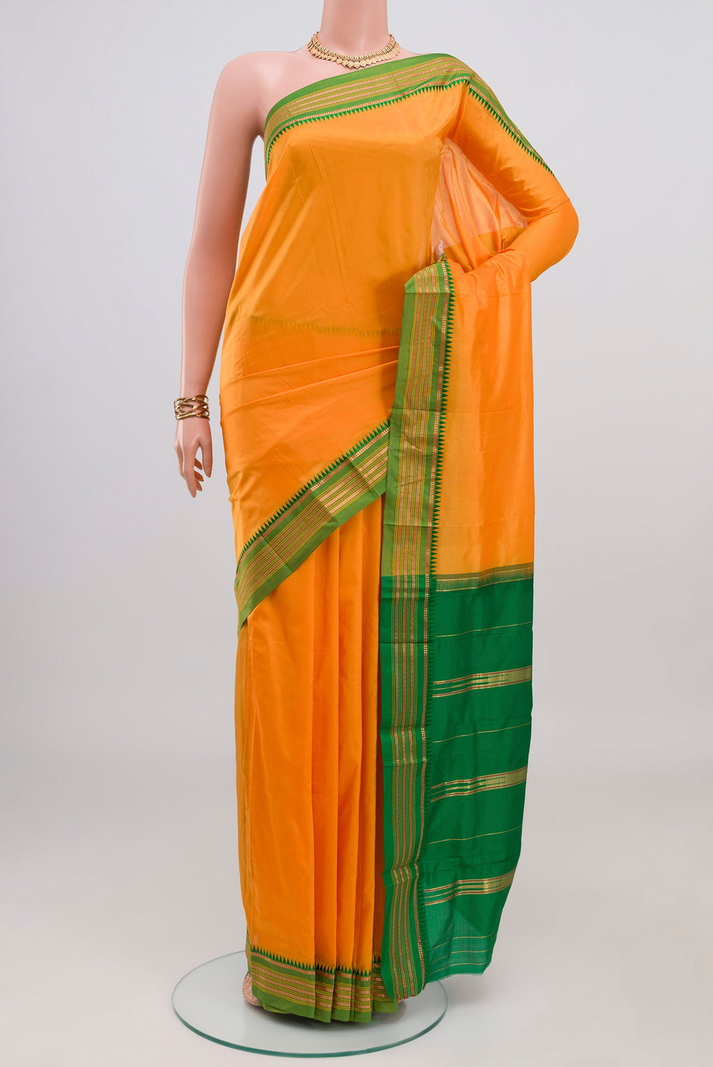 Yellow Narayanpet Silk Saree with Plain Body and Zari Border.  displayed on a mannequin