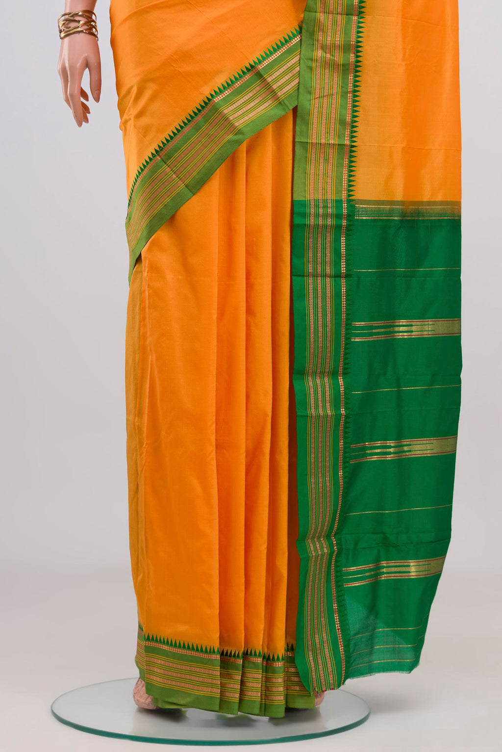 Pleats and pallu of Yellow Narayanpet Silk Saree with Plain Body and Zari Border. 