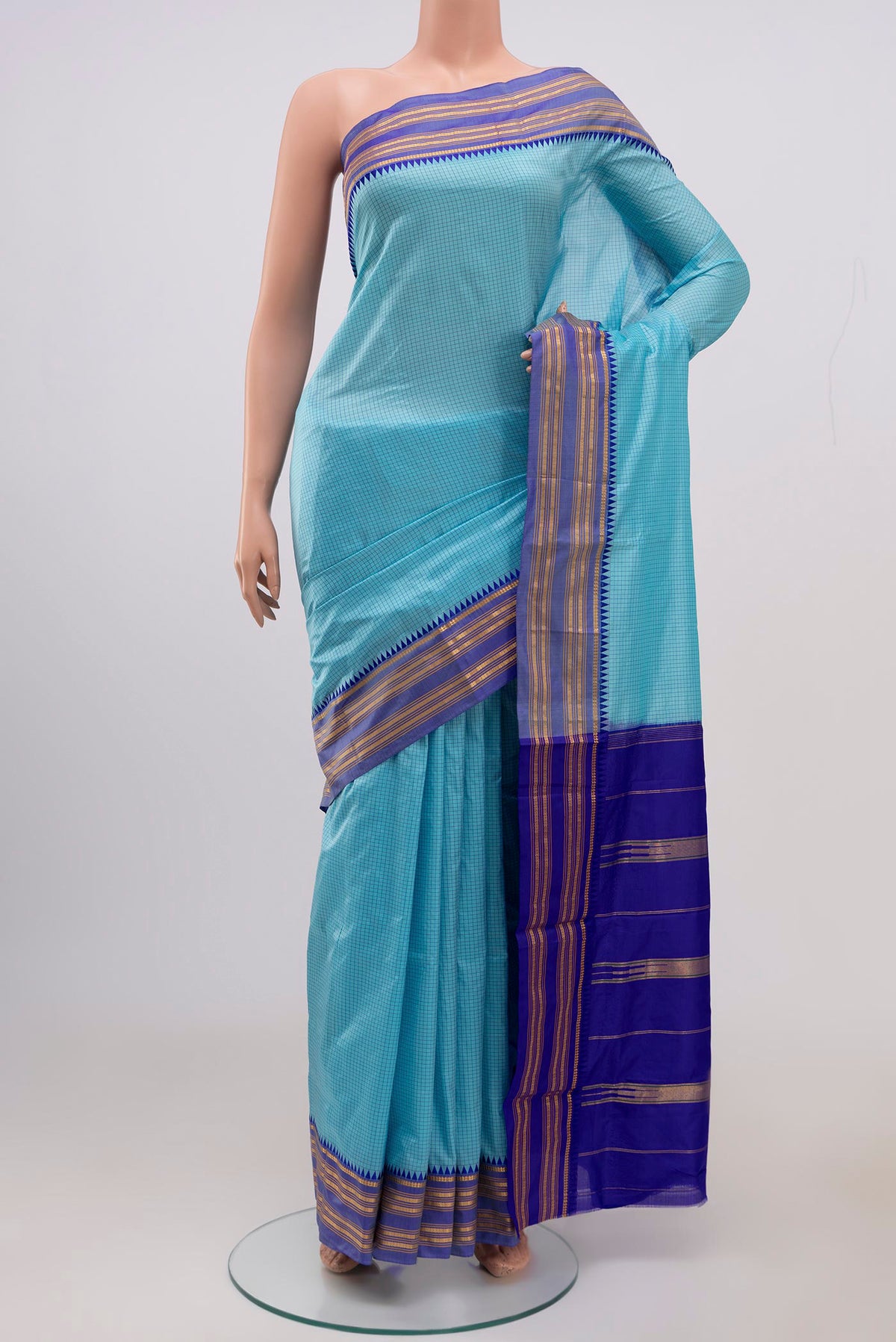 Sky Blue Narayanpet Silk Saree with Checked design on the body and Thin Zari Line.  displayed on a mannequin