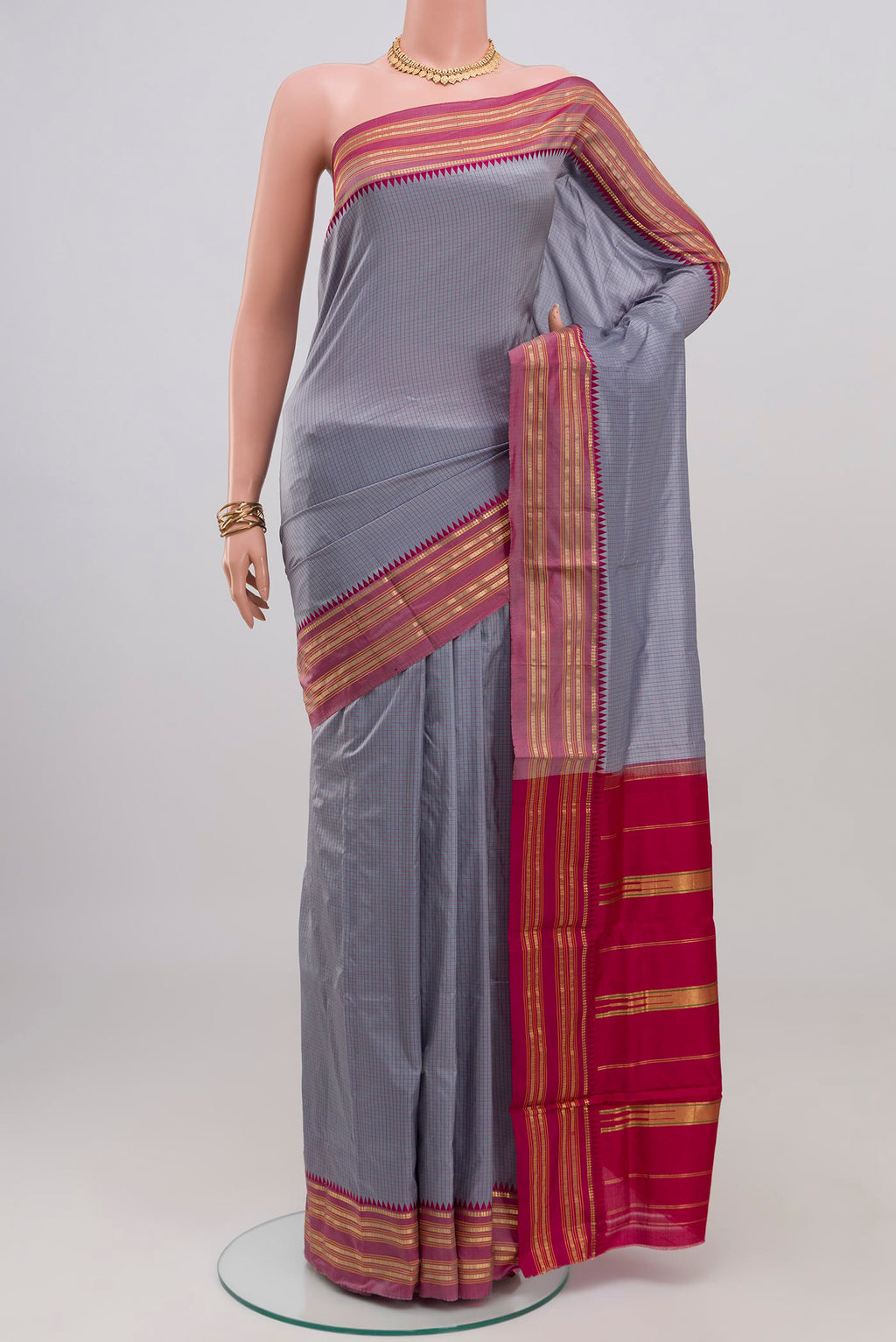 Grey Narayanpet Silk Saree with Checked design on the body and Zari Border.  displayed on a mannequin