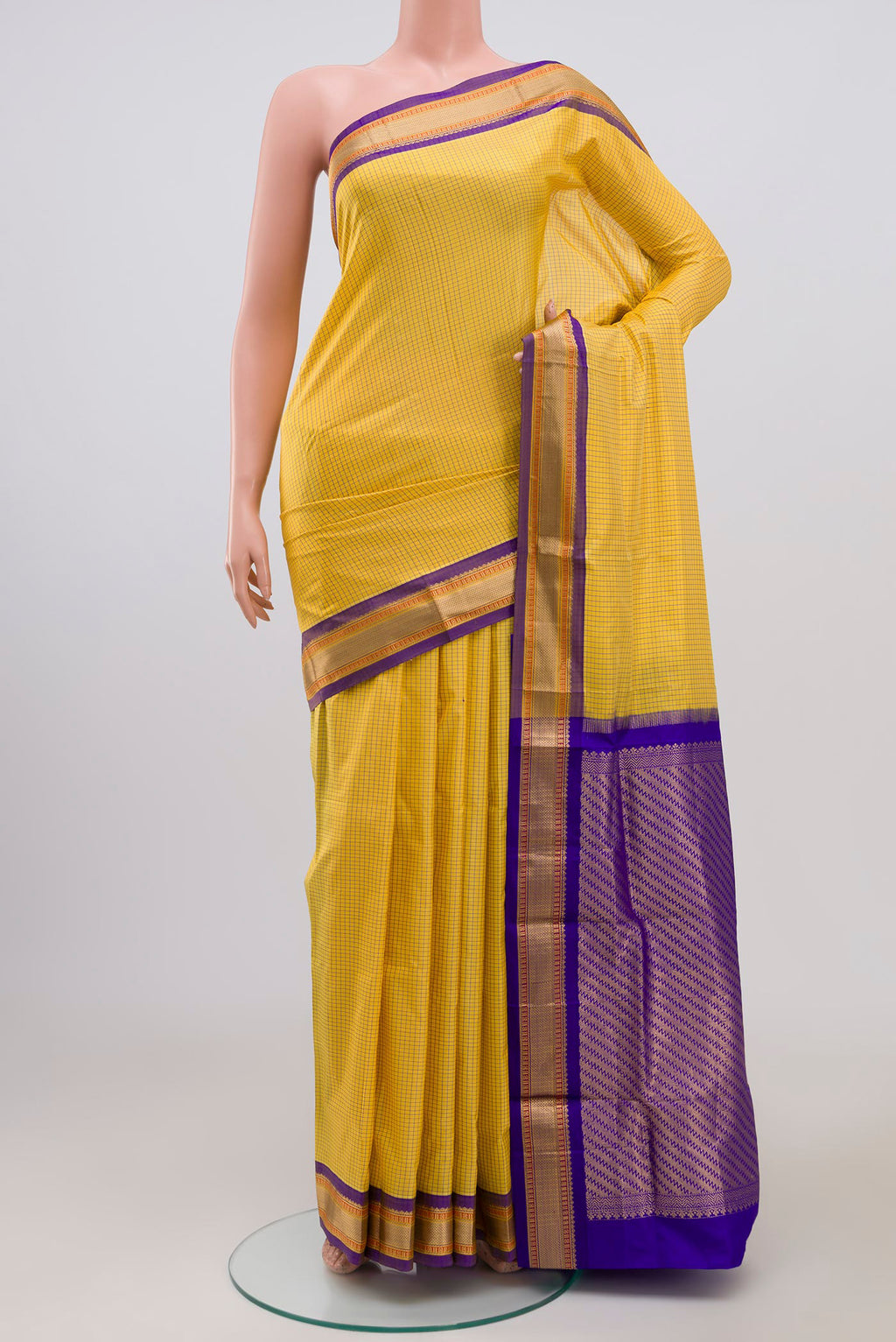 Yellow Narayanpet Silk Saree with Checked design on the body and Zari Border.  displayed on a mannequin