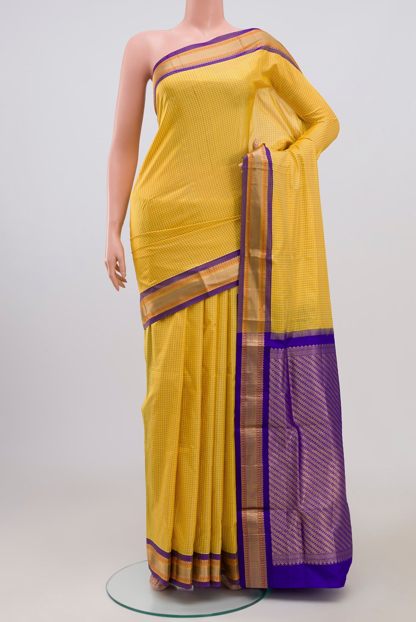 Yellow Narayanpet Silk Saree with Checked design on the body and Zari Border.  displayed on a mannequin