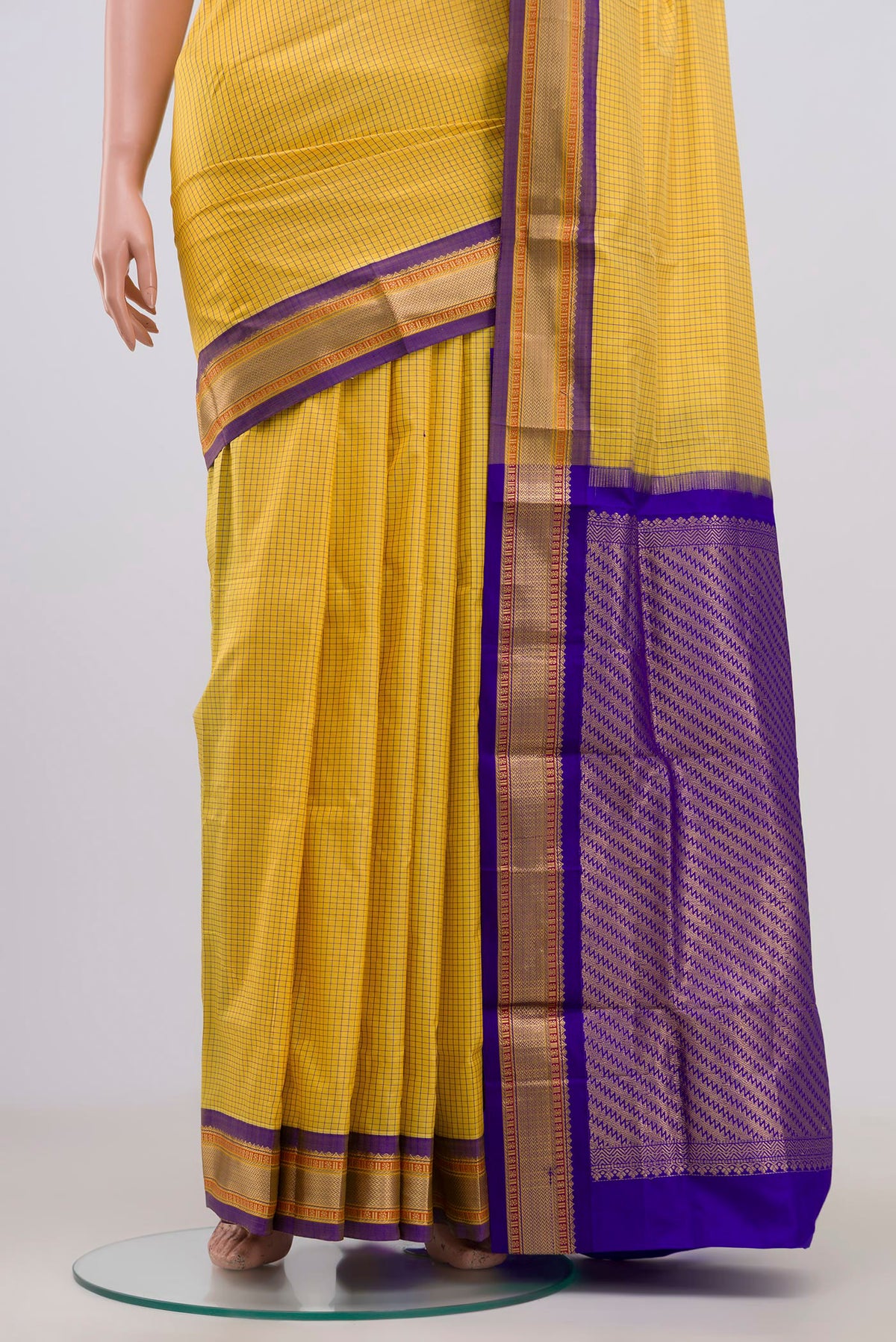 Pleats and pallu of Yellow Narayanpet Silk Saree with Checked design on the body and Zari Border. 