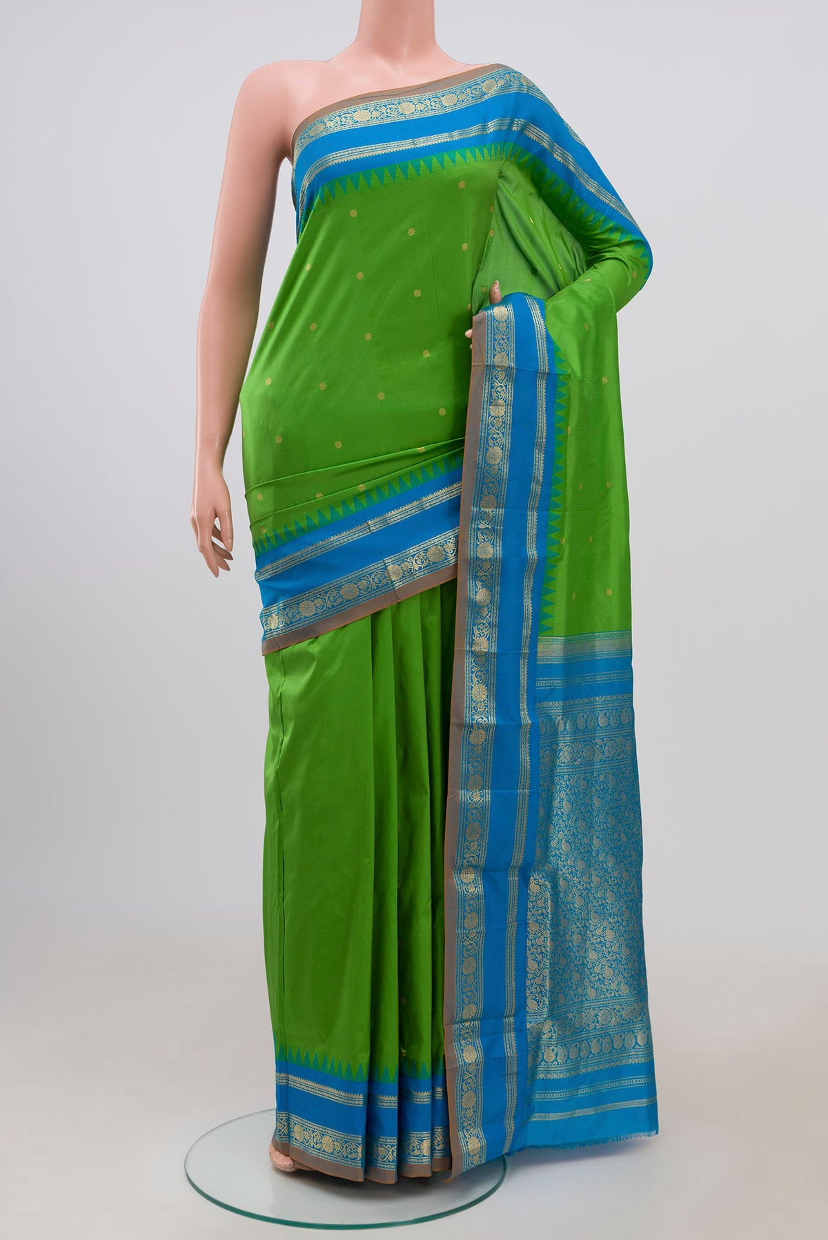 Green Narayanpet Silk Saree with Zari Butta on the body and Zari Border.  displayed on a mannequin