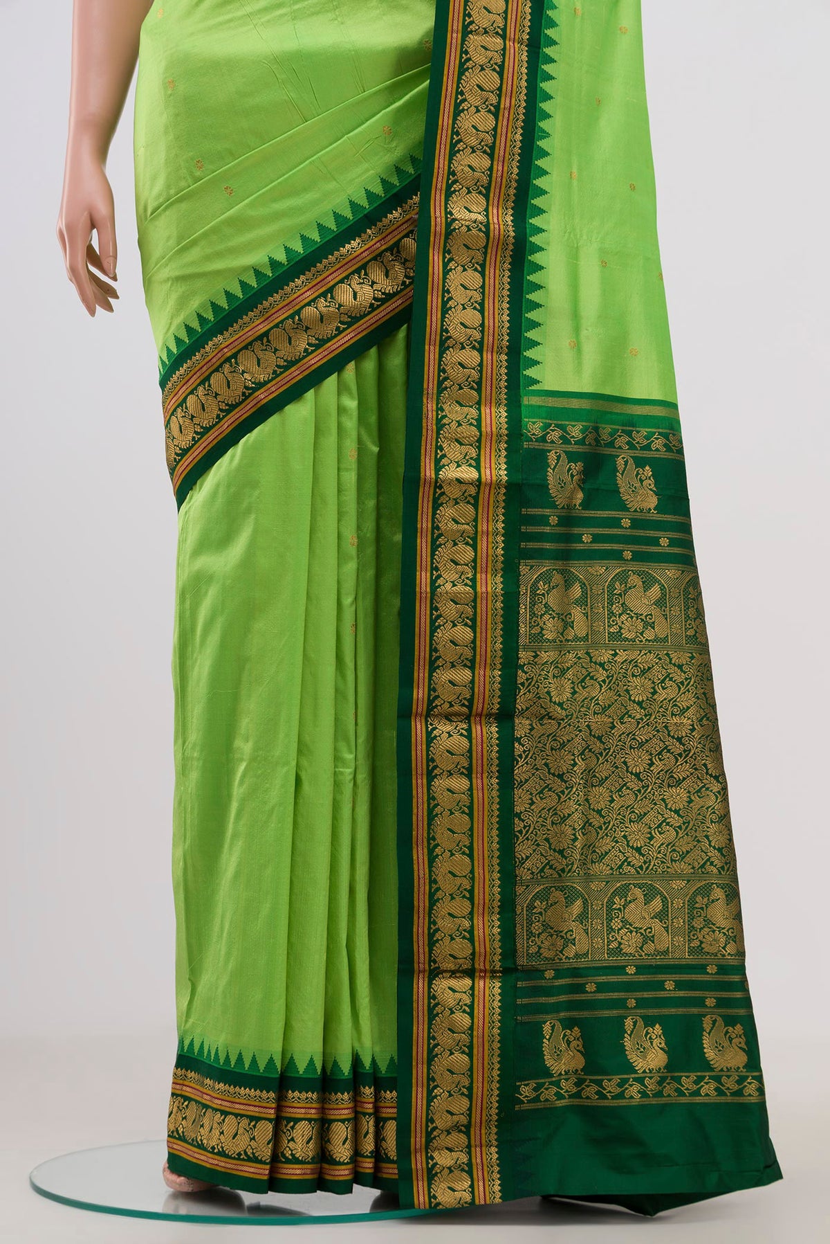 Pleats and pallu of Parrot Green Bangalore Silk Saree with Zari Butta on the body and Zari Border. 