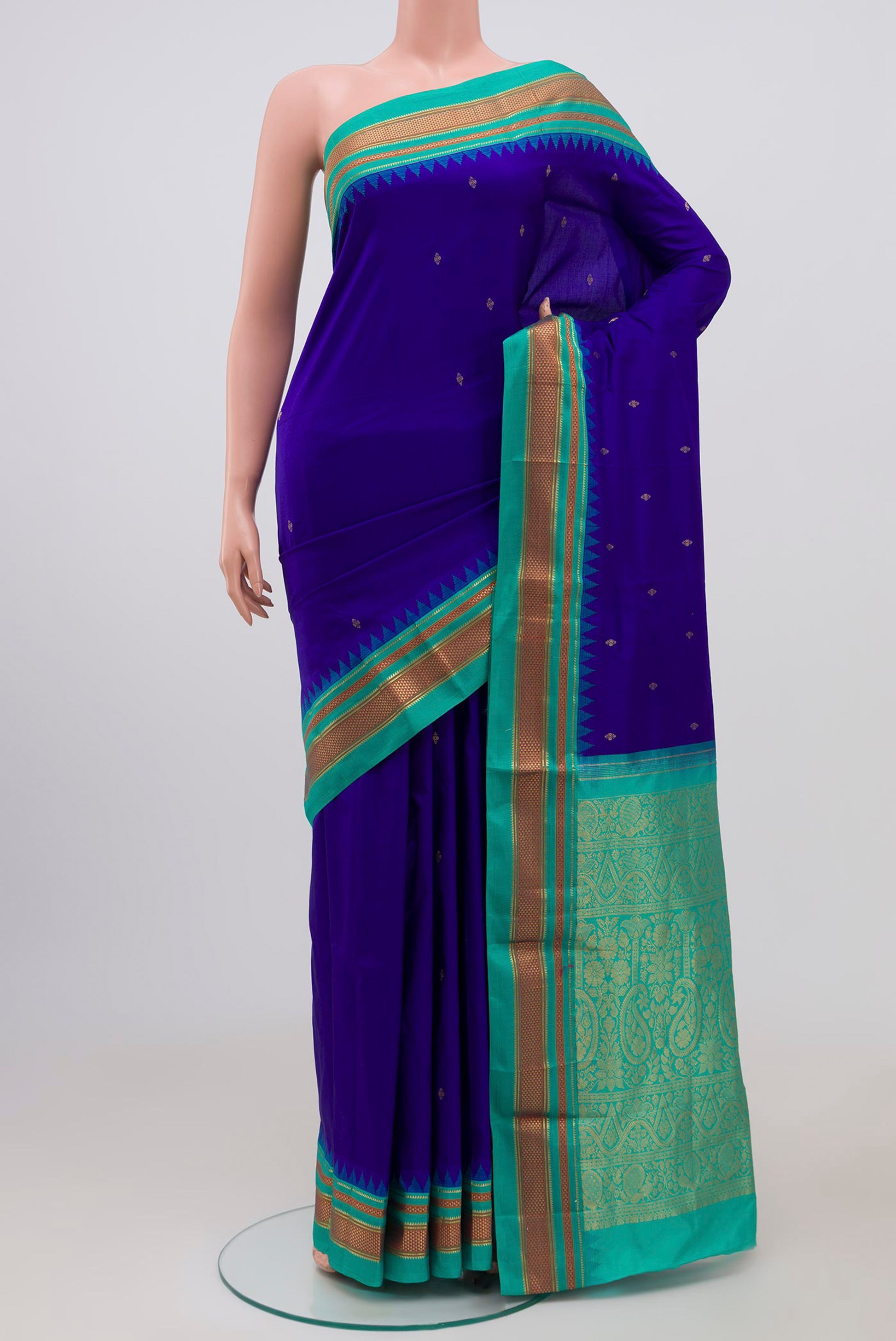 Navy Blue Narayanpet Silk Saree with Zari Butta on the body and Zari Border.  displayed on a mannequin