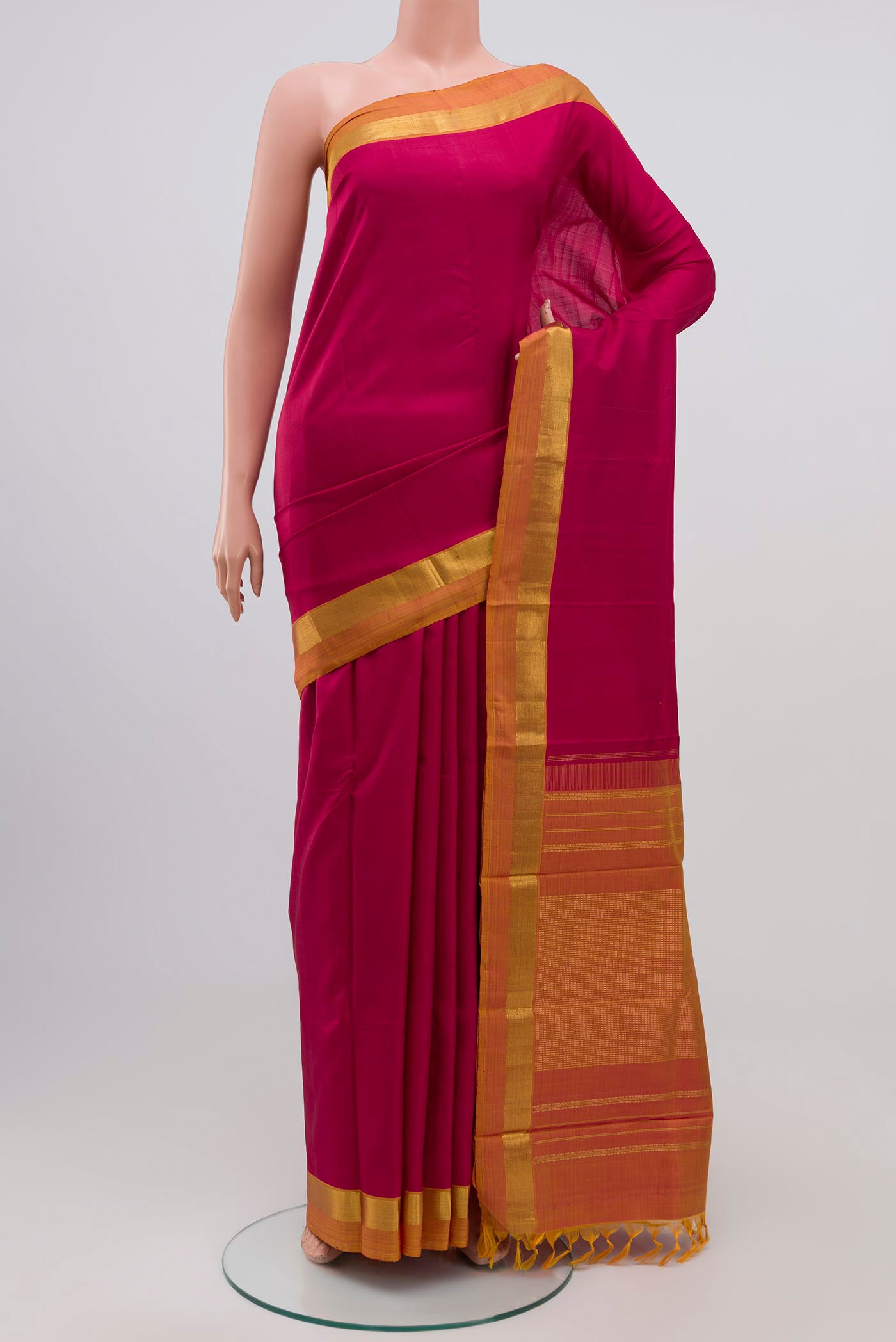 Maroon Kanjivaram Silk Saree with Plain Body and Zari Border.  displayed on a mannequin