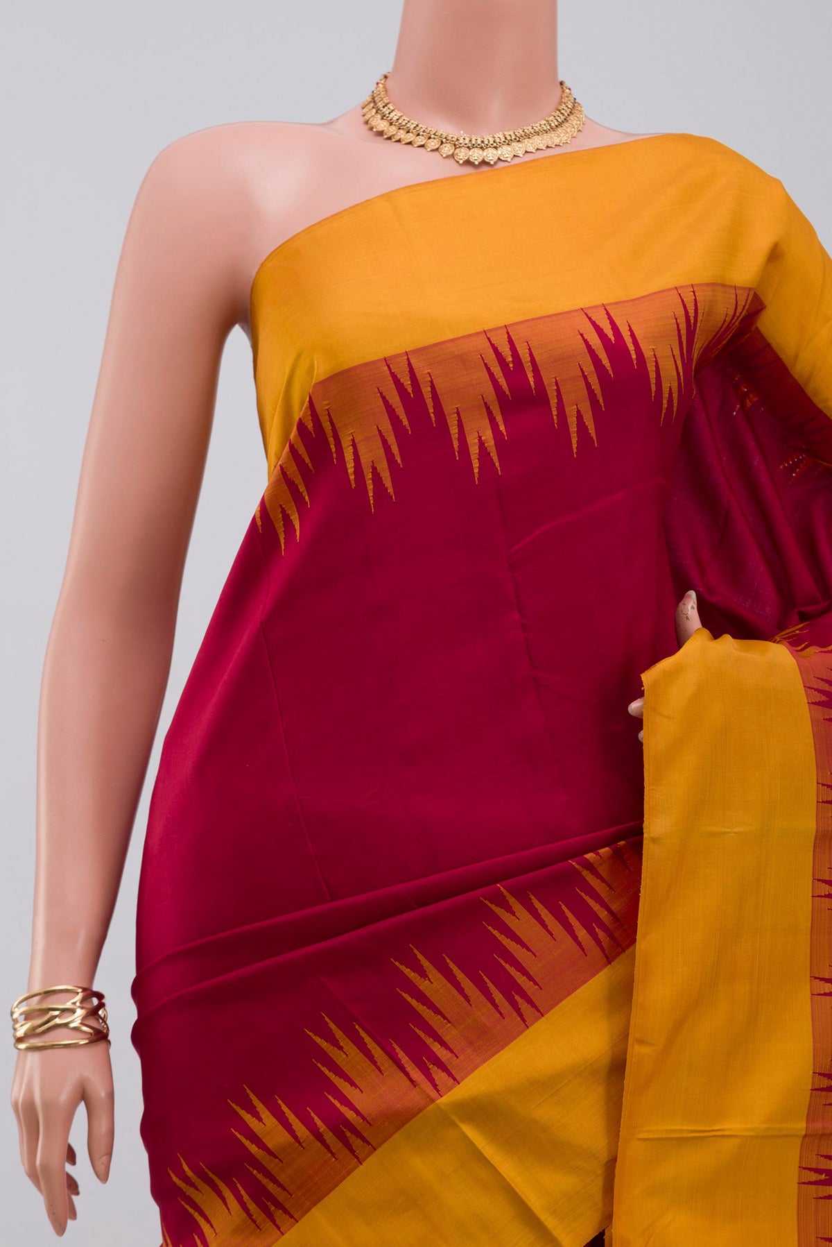 Border image of Maroon Kanjivaram Silk Saree with Plain Body and Temple Border. 