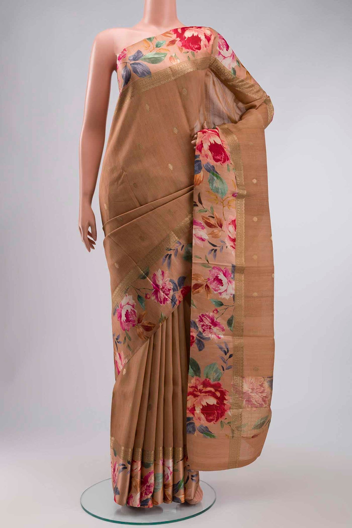 Brown Tussar Silk Saree with Zari Butta on the body and Printed Border displayed on a mannequin