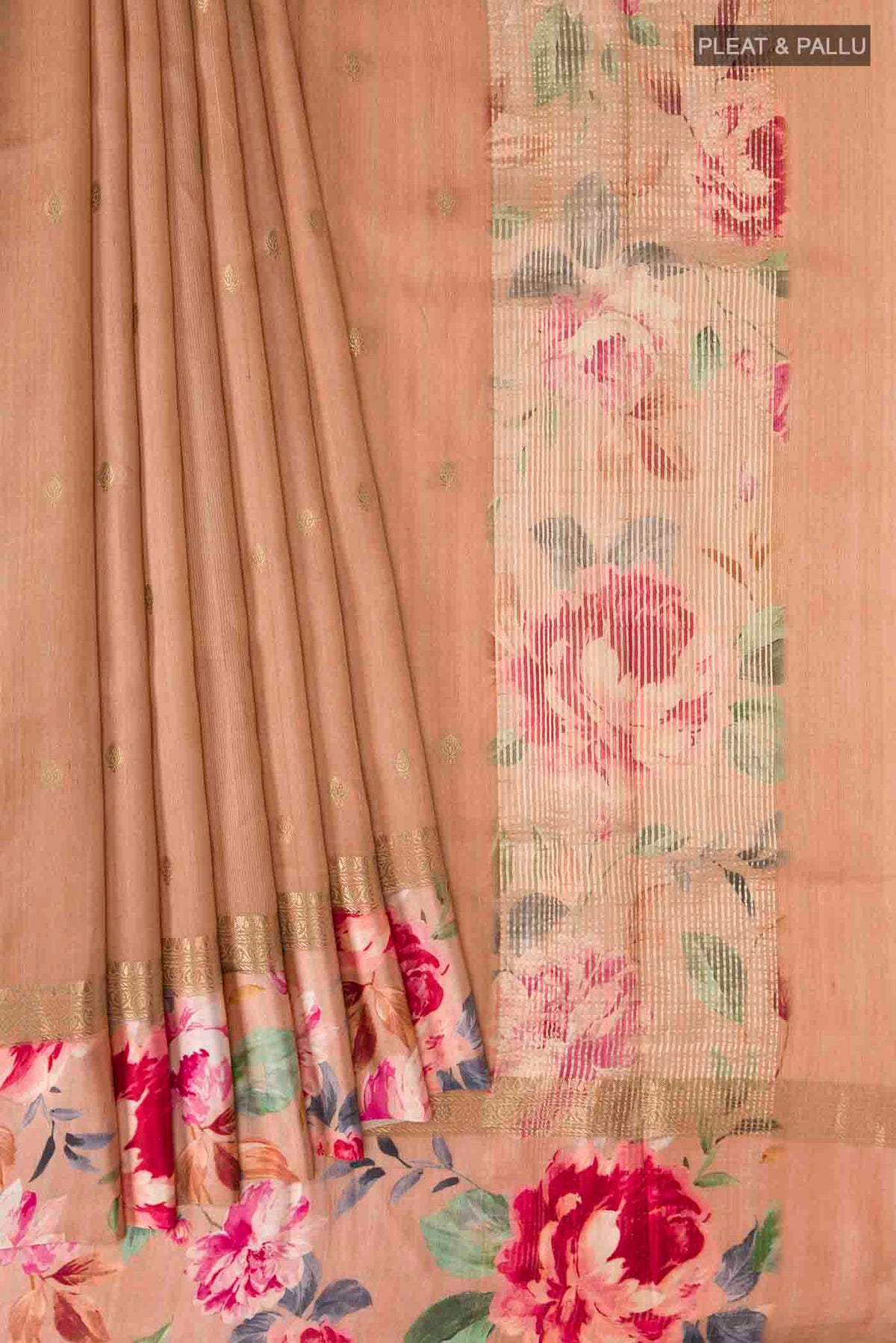 Pleats and pallu of Brown Tussar Silk Saree with Zari Butta on the body and Printed Border