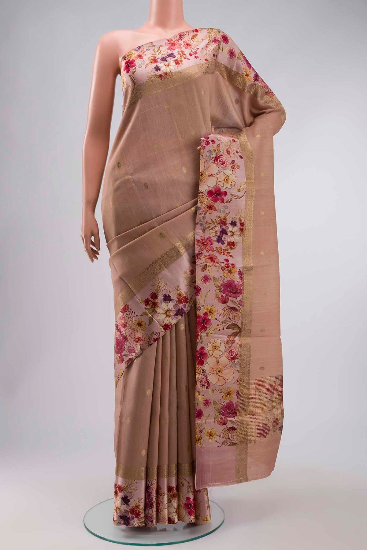 Peach Tussar Silk Saree with Zari Butta on the body and Printed Border displayed on a mannequin