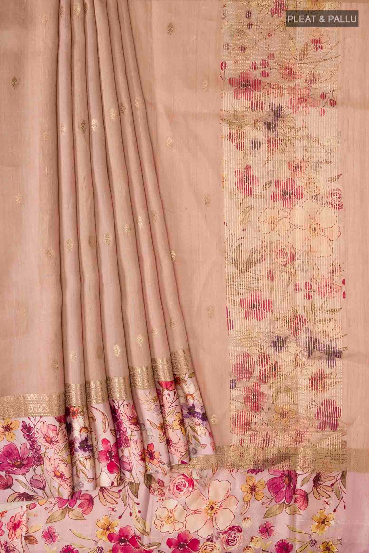 Pleats and pallu of Peach Tussar Silk Saree with Zari Butta on the body and Printed Border