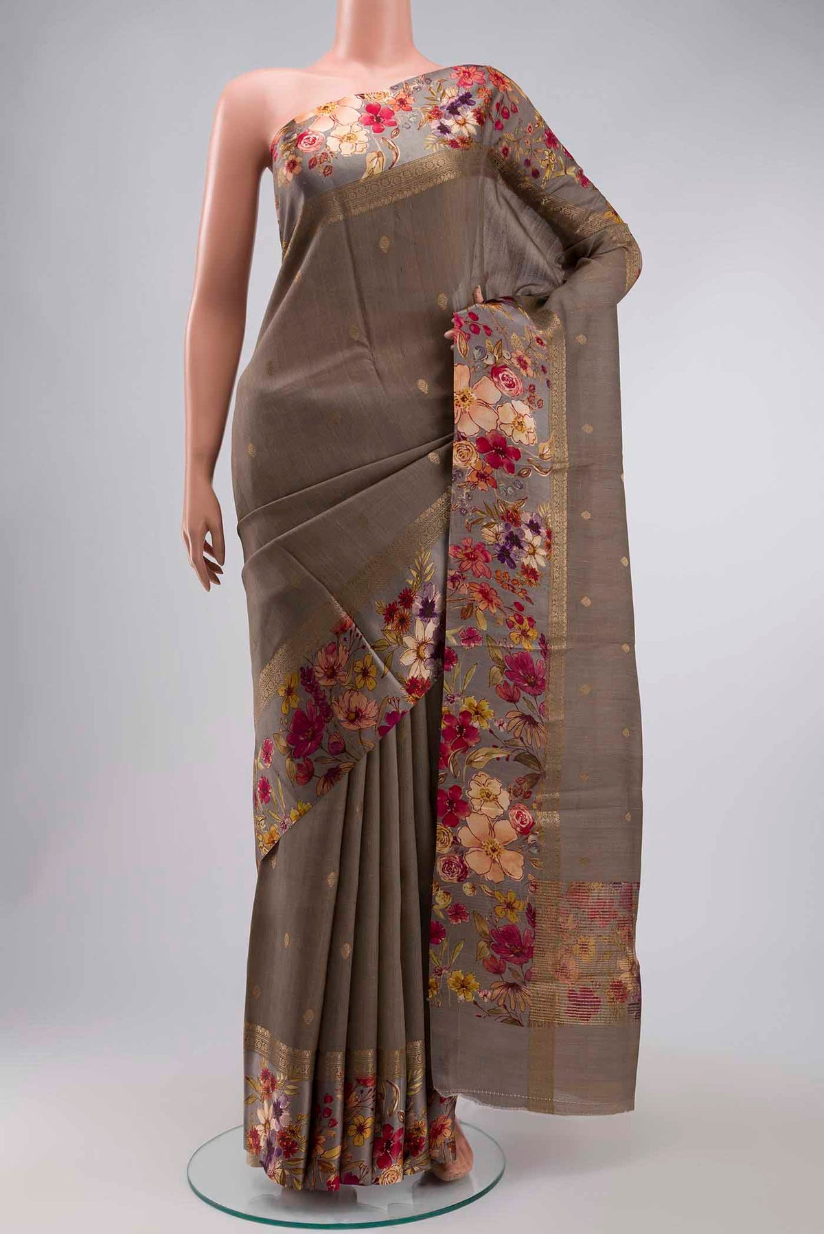 Grey Tussar Silk Saree with Zari Butta on the body and Printed Border displayed on a mannequin