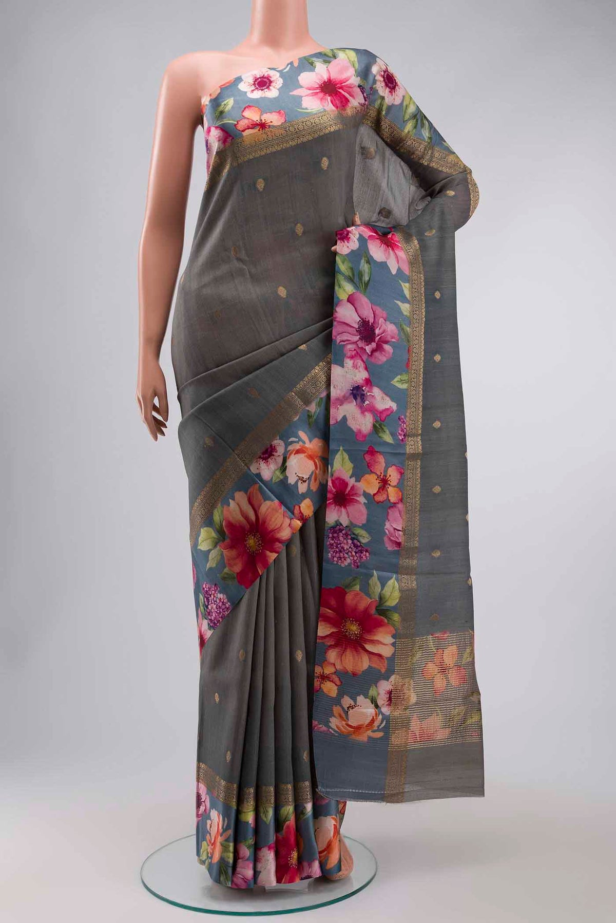 Grey Tussar Silk Saree with Zari Butta on the body and Printed Border displayed on a mannequin