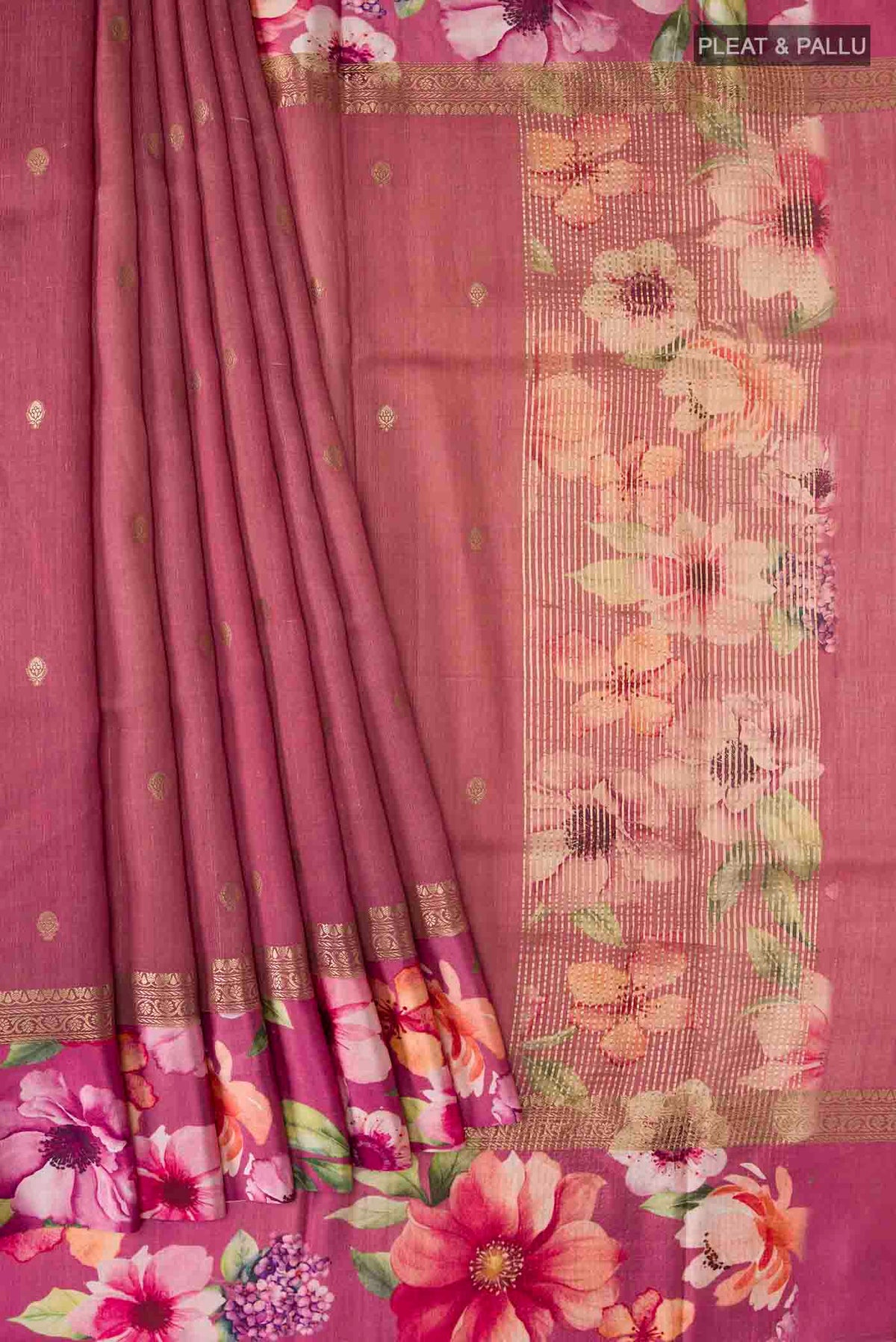 Pleats and pallu of Mauve Tussar Silk Saree with Zari Butta on the body and Printed Border