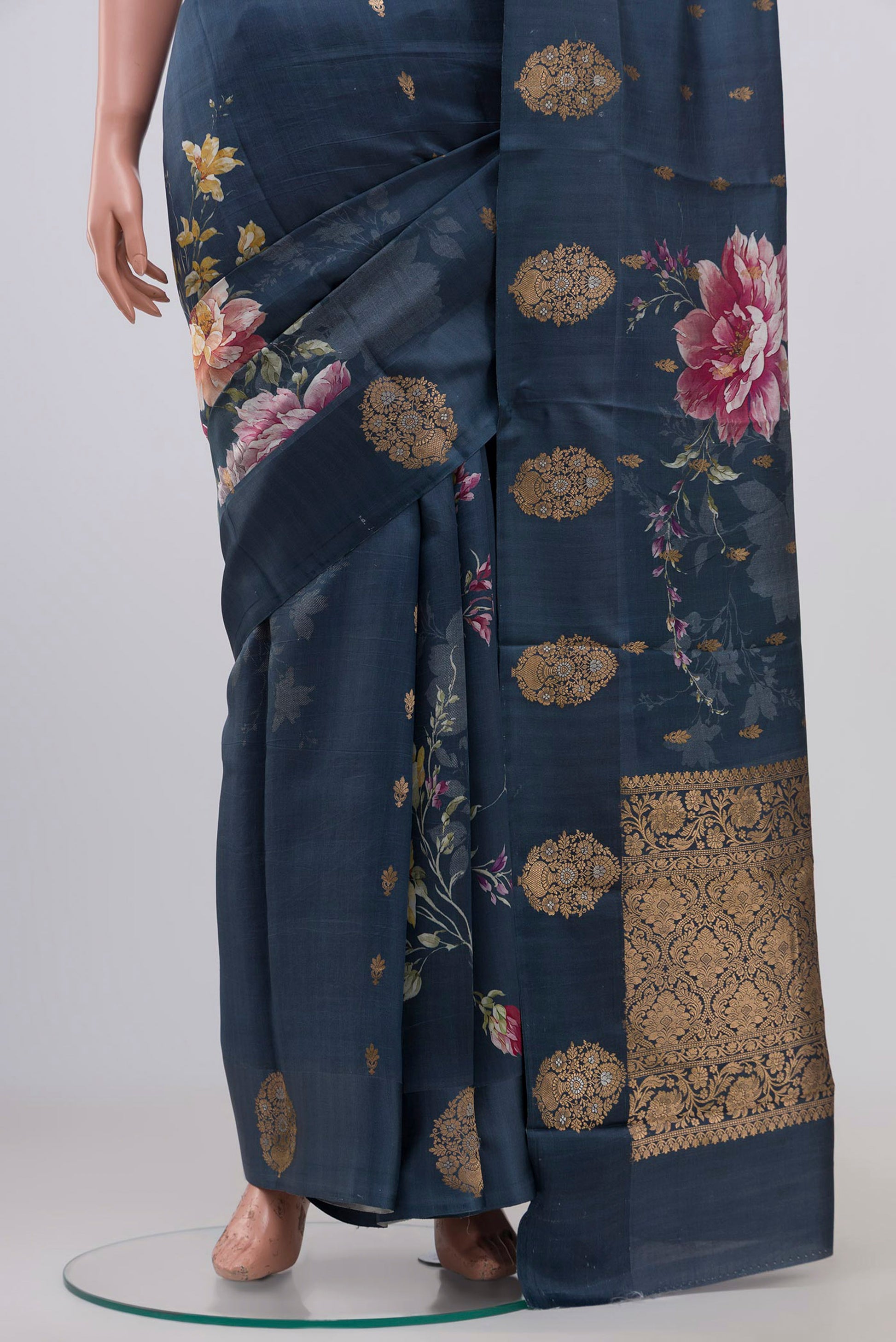 Pleats and pallu of Blue Grey Banarasi Raw Silk Saree with Zari Butta on the body and Fancy Border. 
