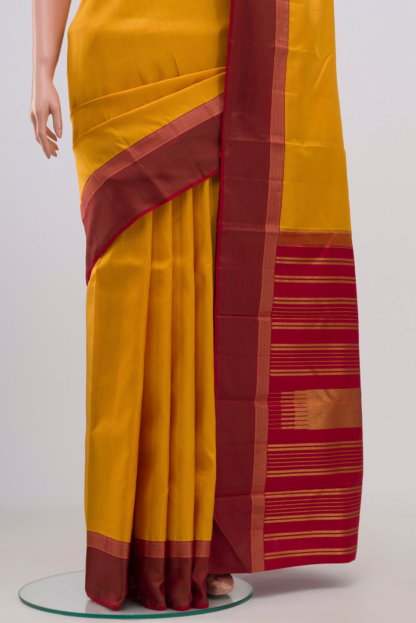 Pleats and pallu of Pure Silk Pure Zari Yellow Kanjivaram Saree with Stripes on the body and Thin Zari Line. 