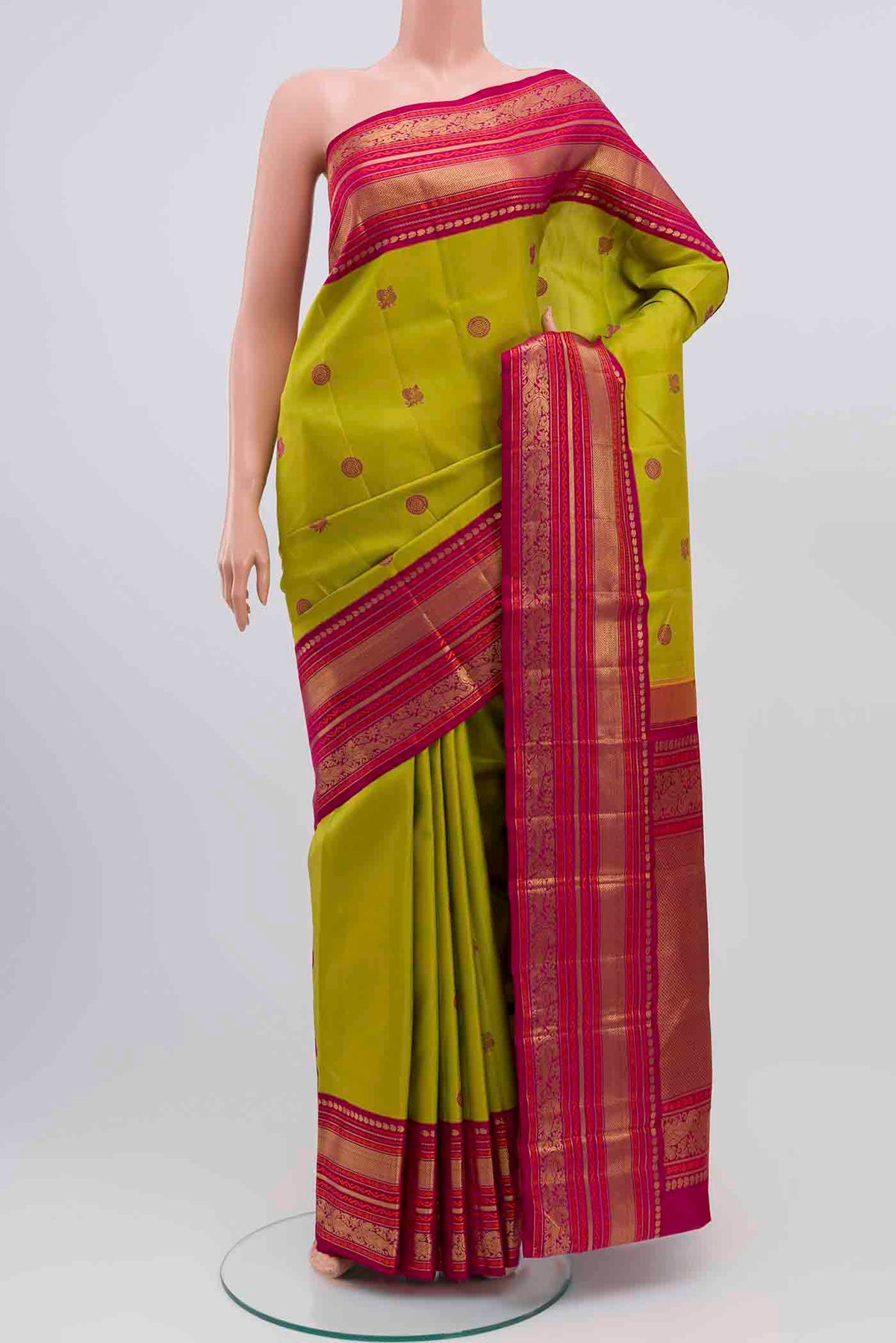 Pure Silk Pure Zari Parrot Green Kanchipuram Saree with Thread Butta on the body and Zari Border displayed on a mannequin