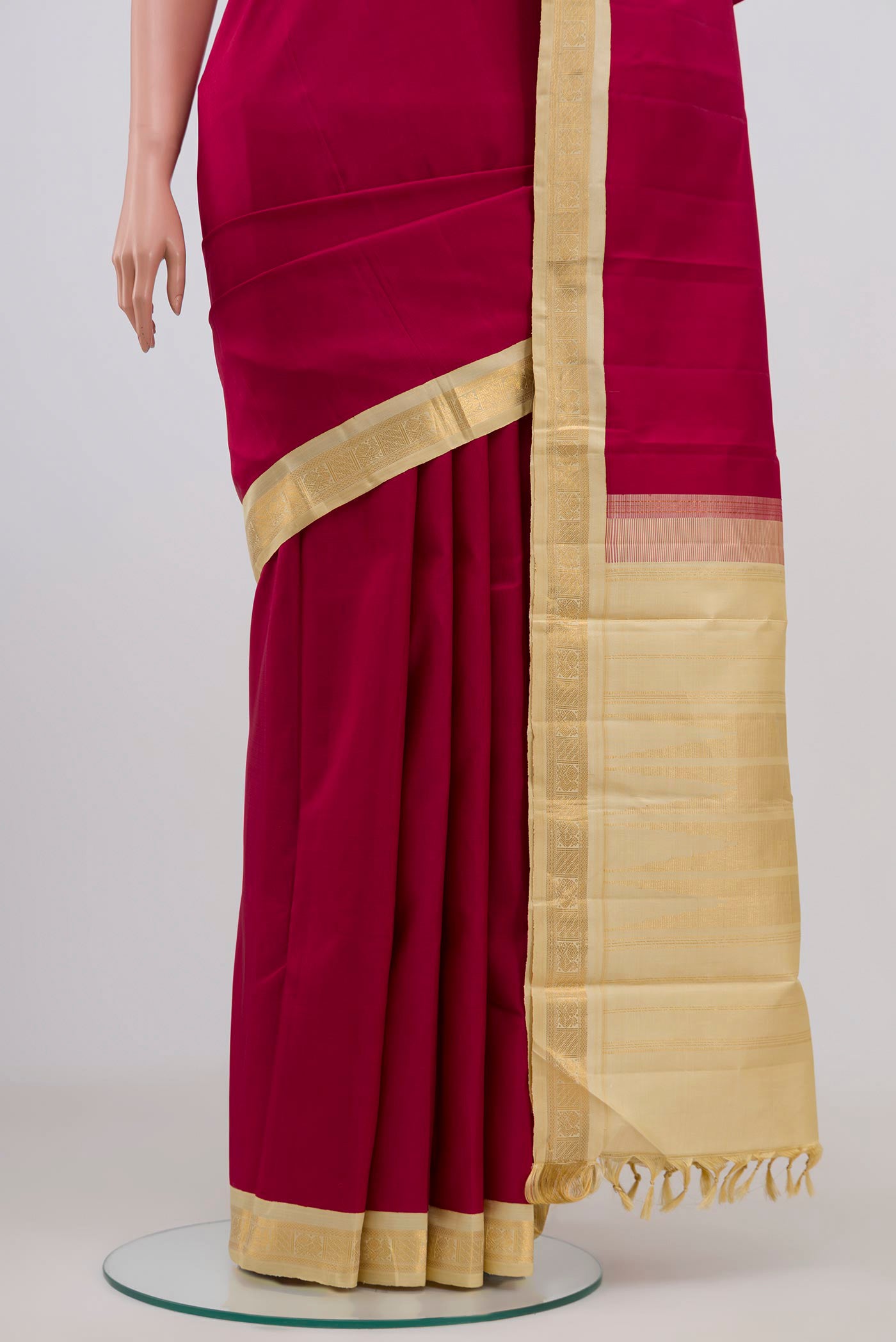 Pleats and pallu of Pure Silk Pure Zari Maroon Kanjivaram Saree with Plain Body and Zari Border. 